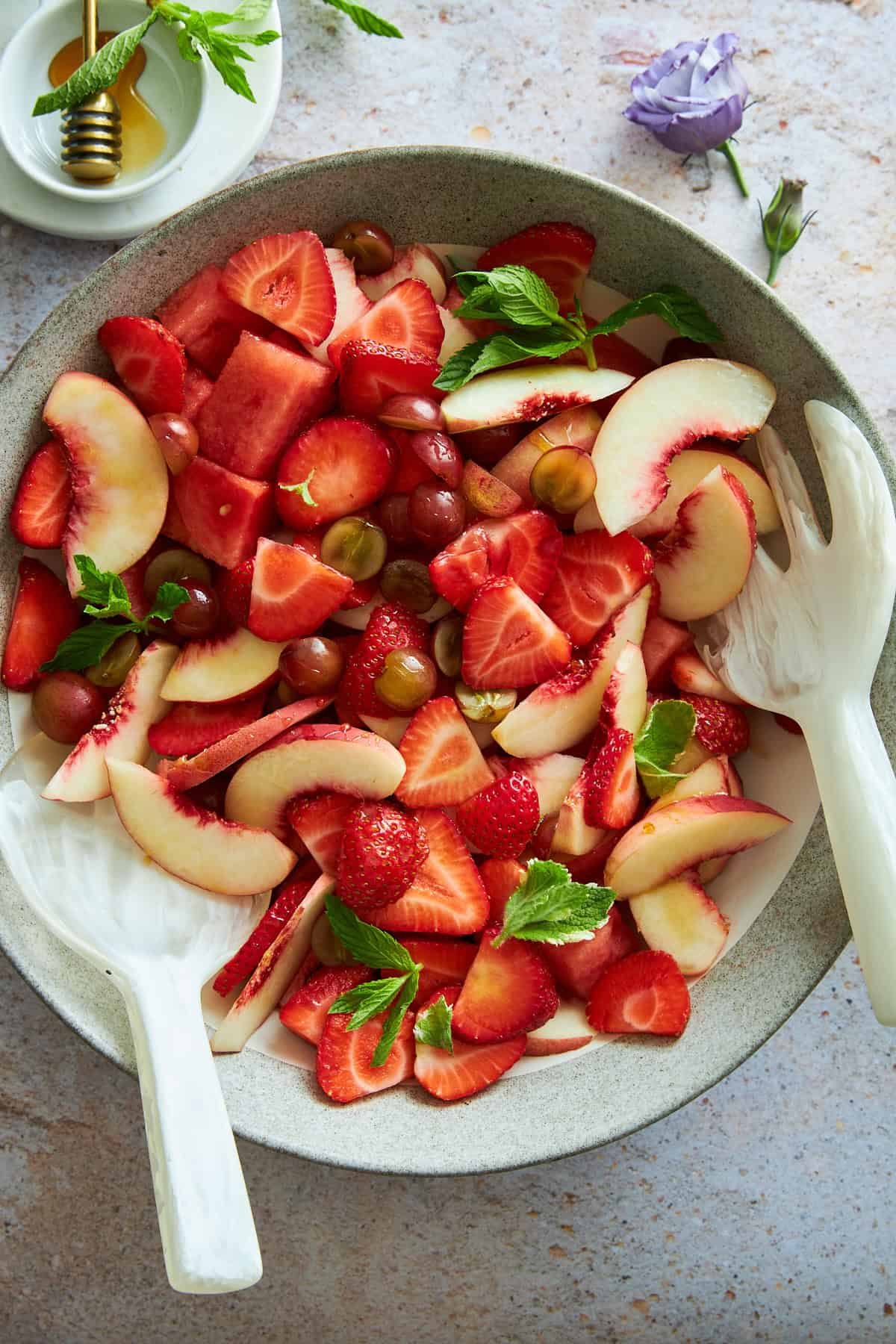 A bowl of peach watermelon salad.