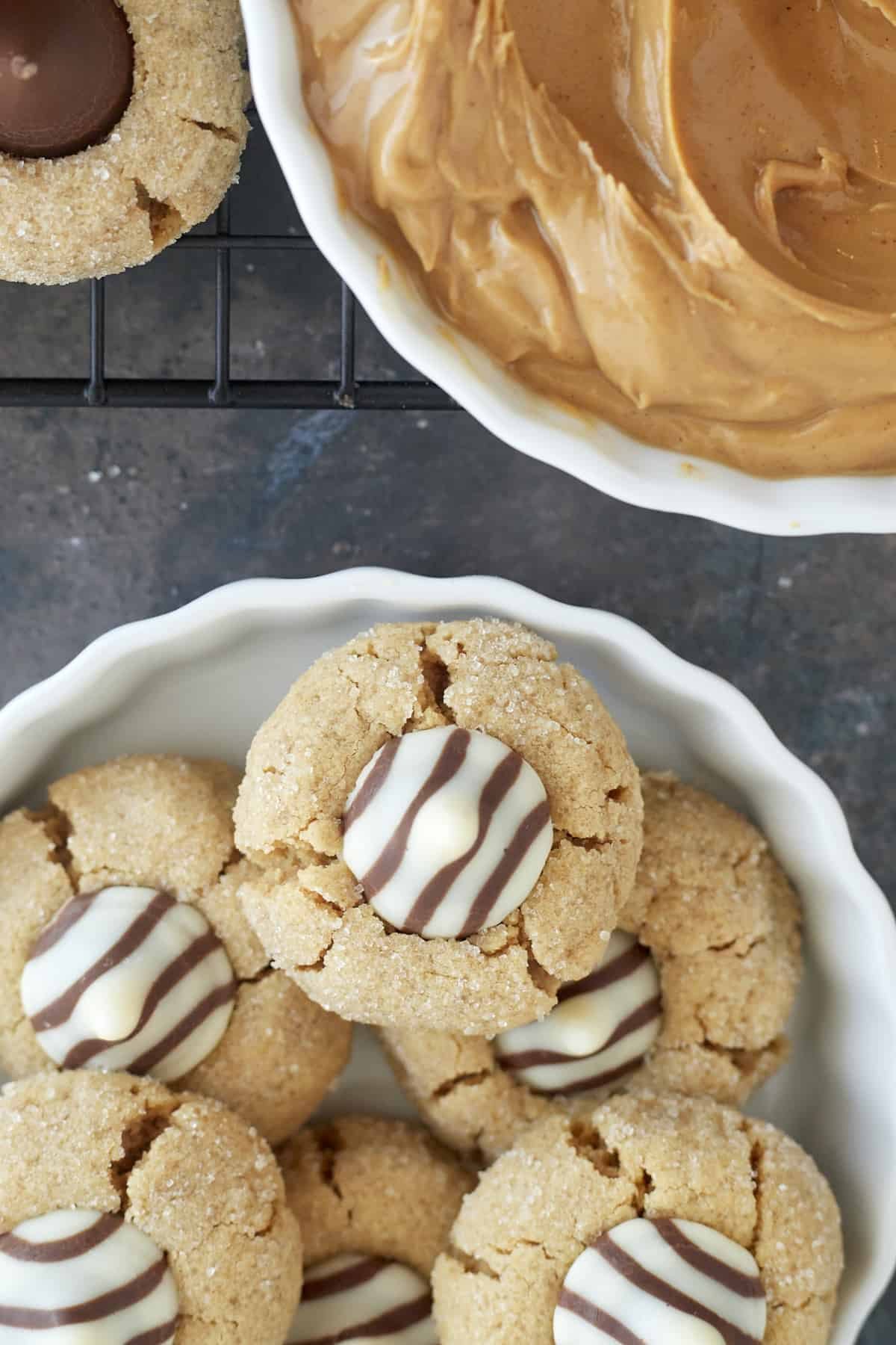 a white bowl of cookies with Hershey's hugs.