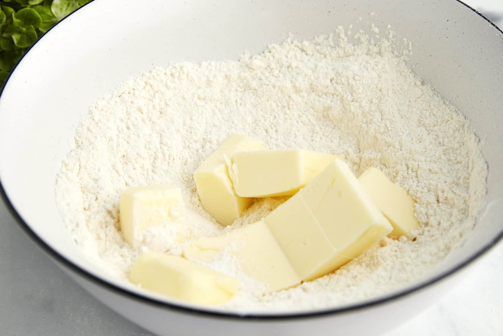 Butter in a bowl of flour.