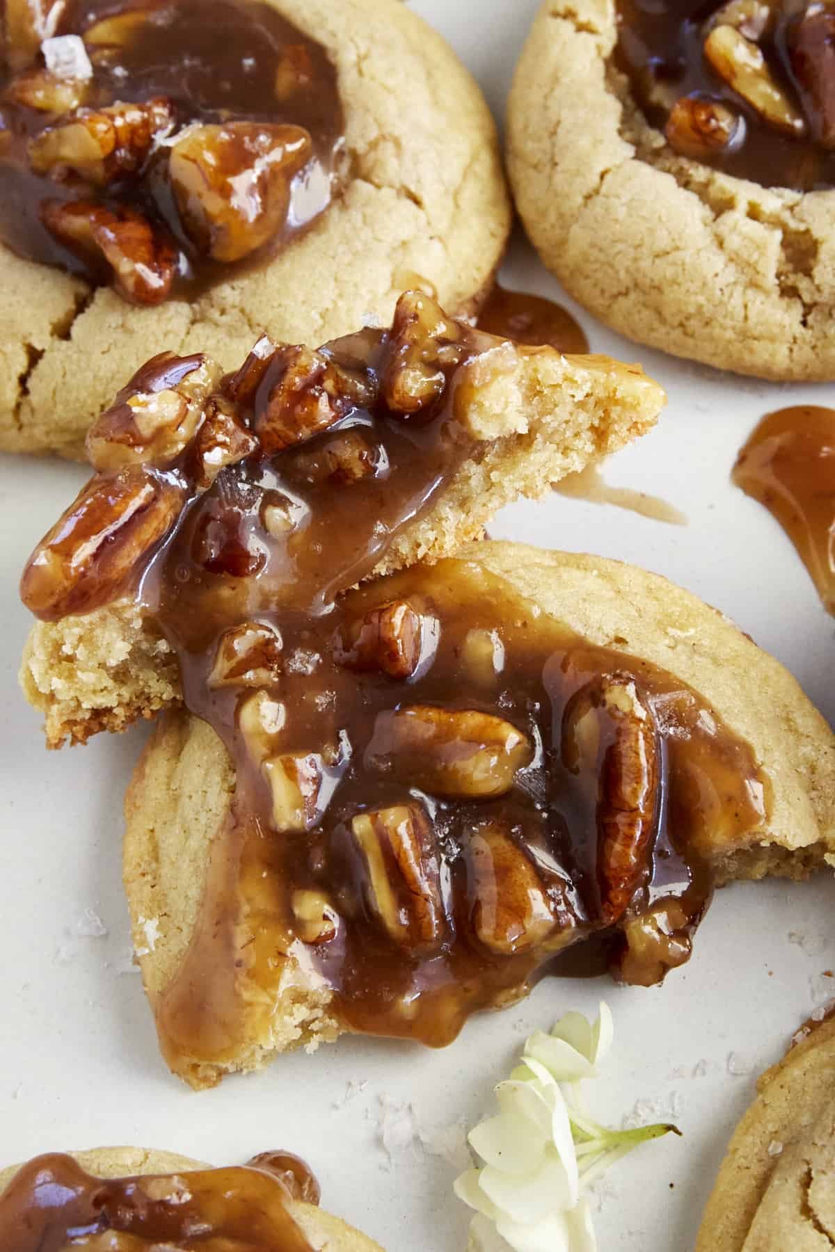 Two halves of a pecan pie cookie.