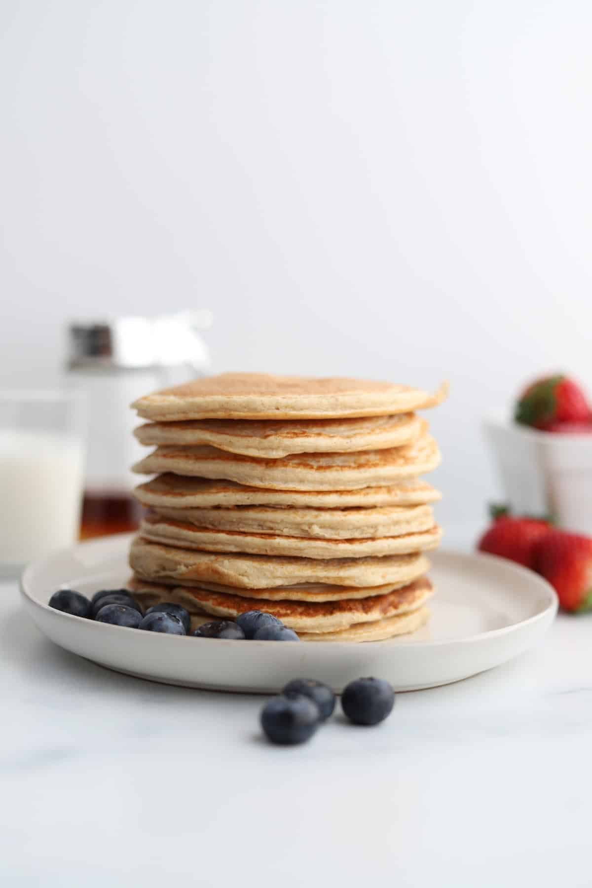 A stack of cottage cheese protein pancakes on a plate.