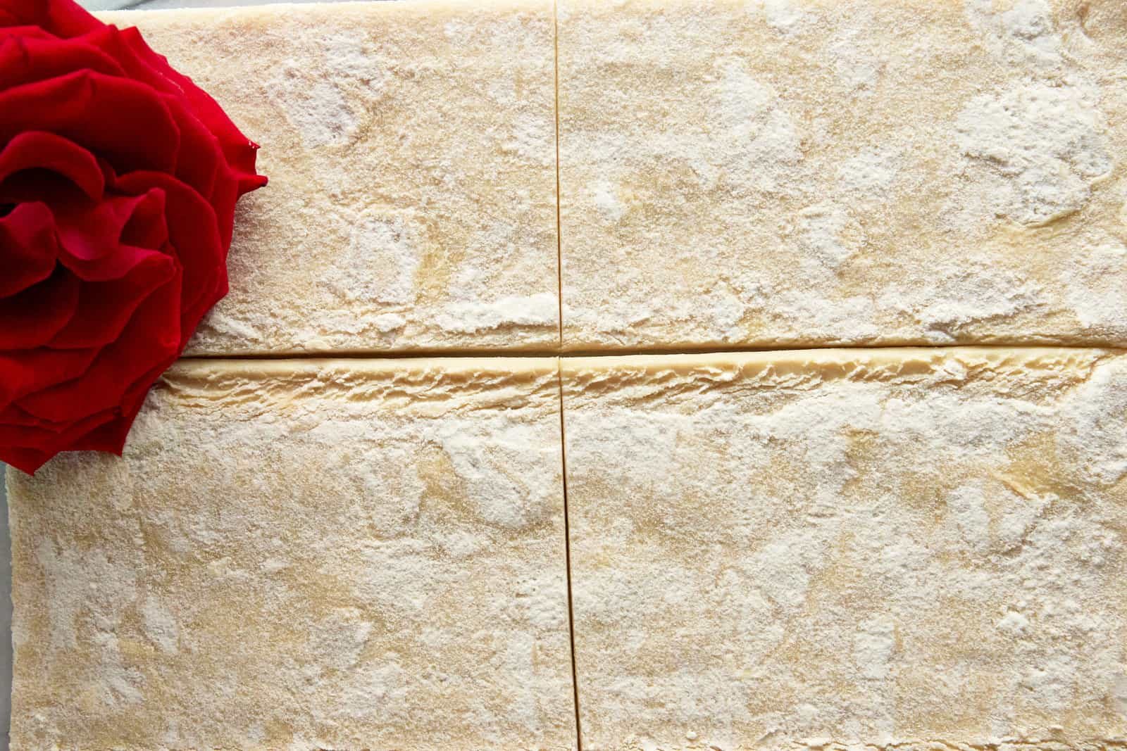 Raw puff pastry squares.