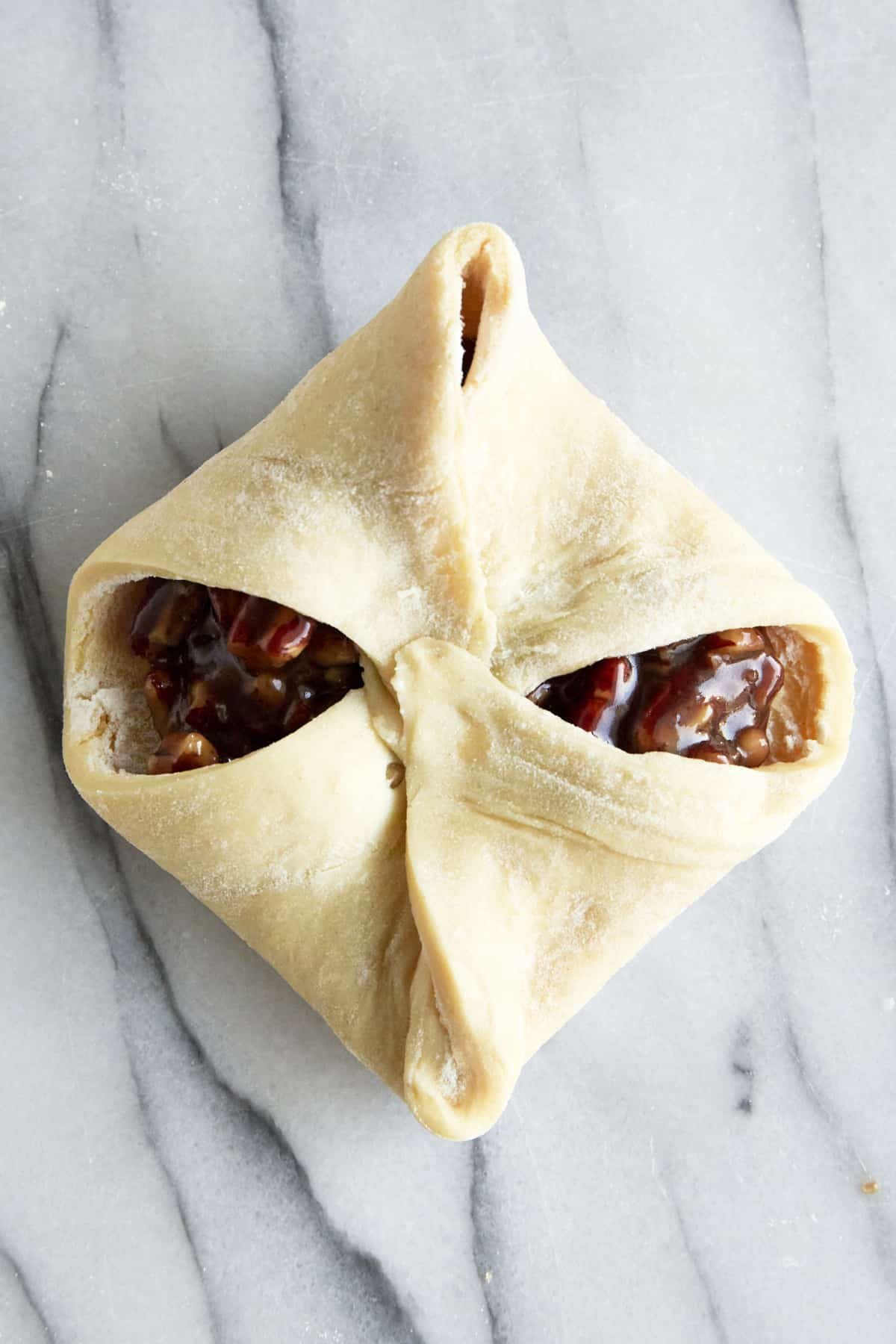 An unbaked mini pecan pie bite.