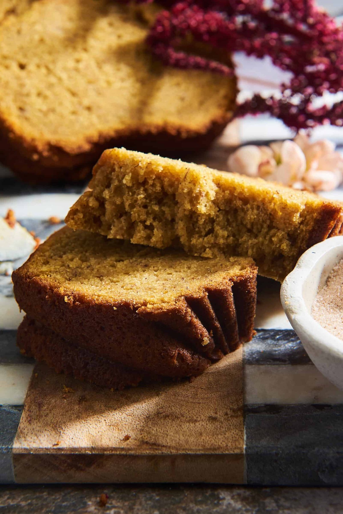 A slice of pumpkin banana bread split in half.