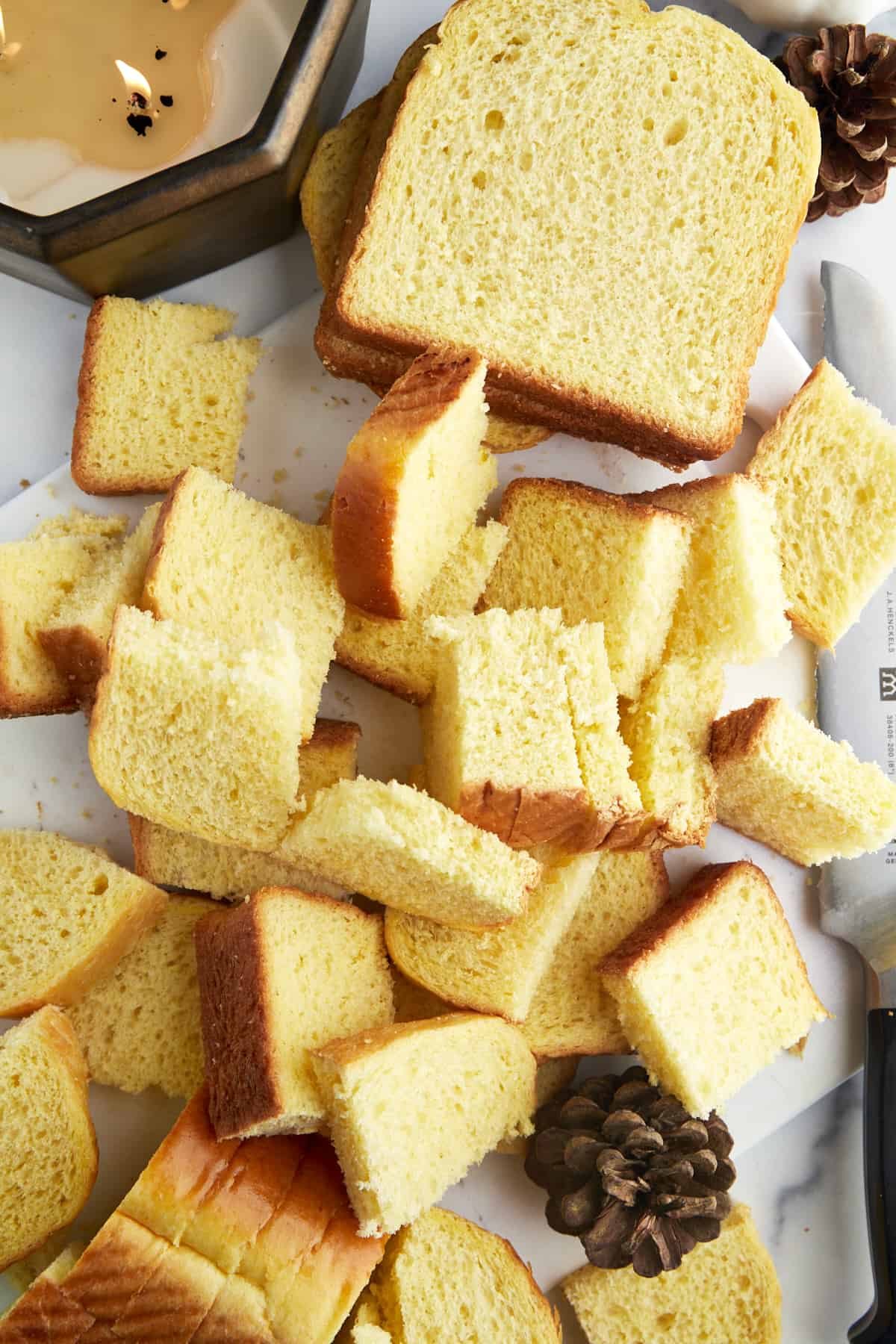 Bread pieces being cubed.