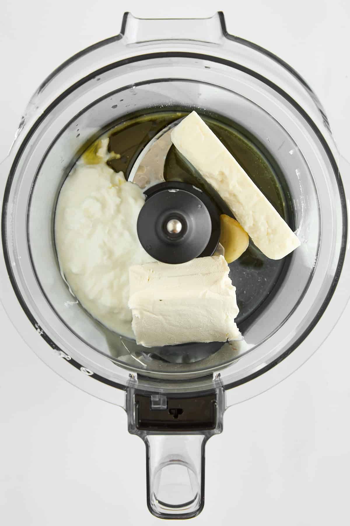 Feta dip ingredients in a food processor.