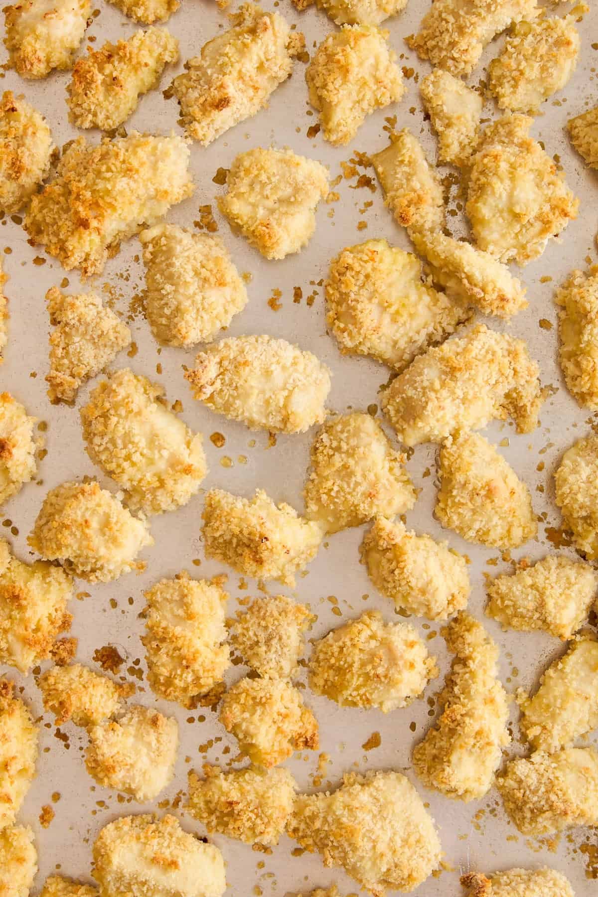 Cooked breaded chicken pieces.