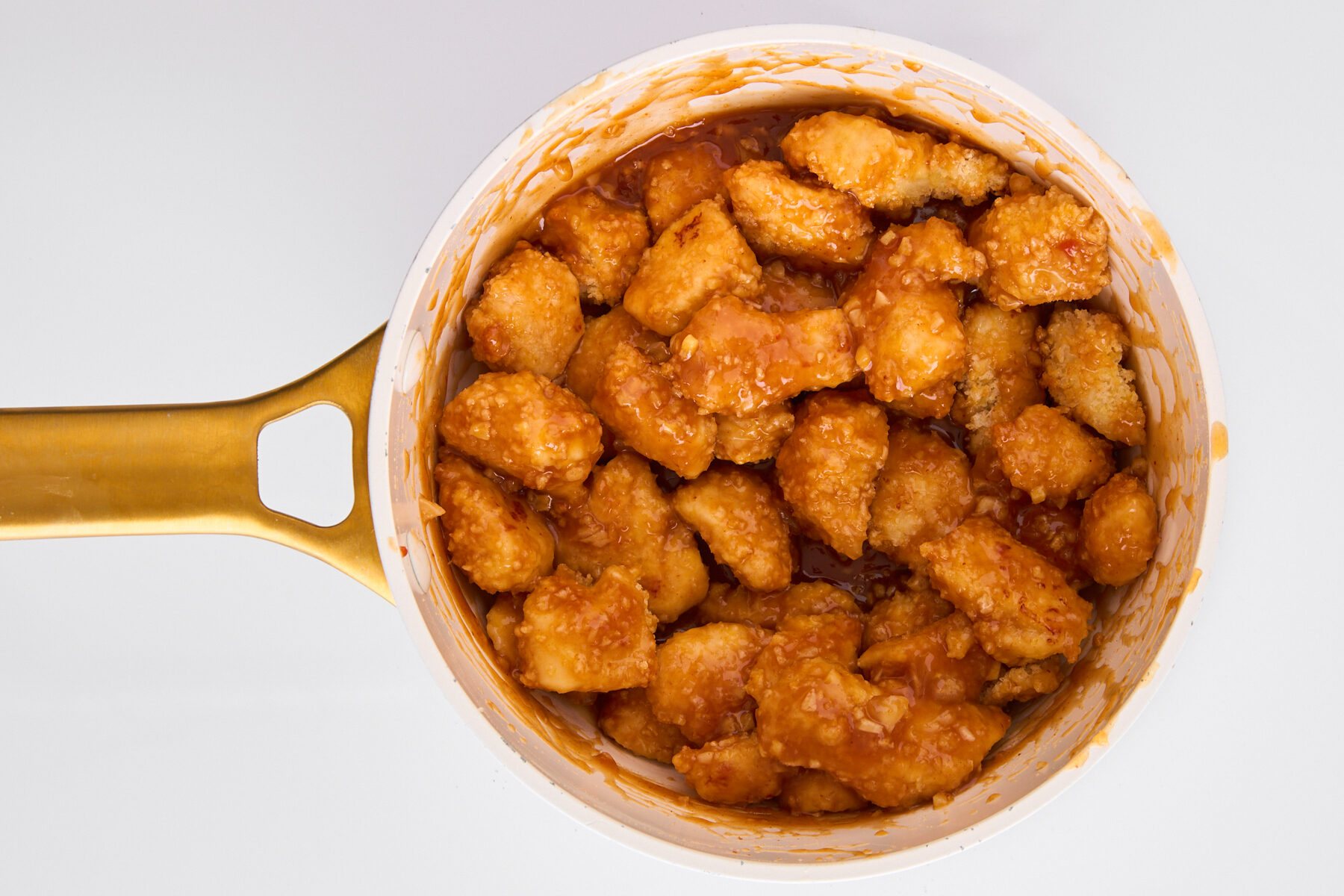 Orange chicken in a pot.