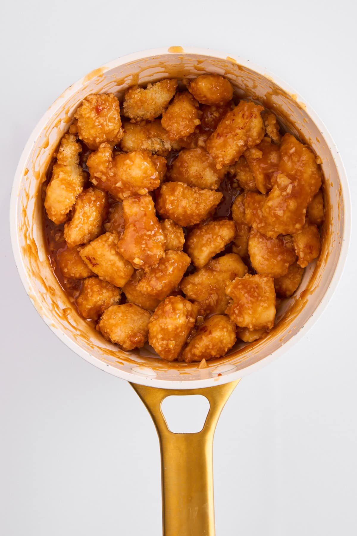Orange chicken in a pot.