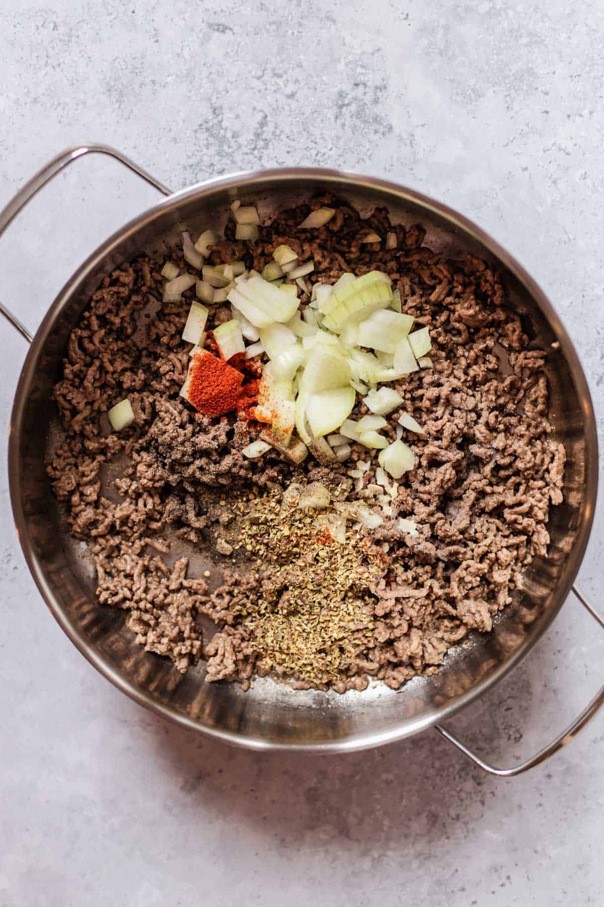 beef, onions, and spices in a large pot