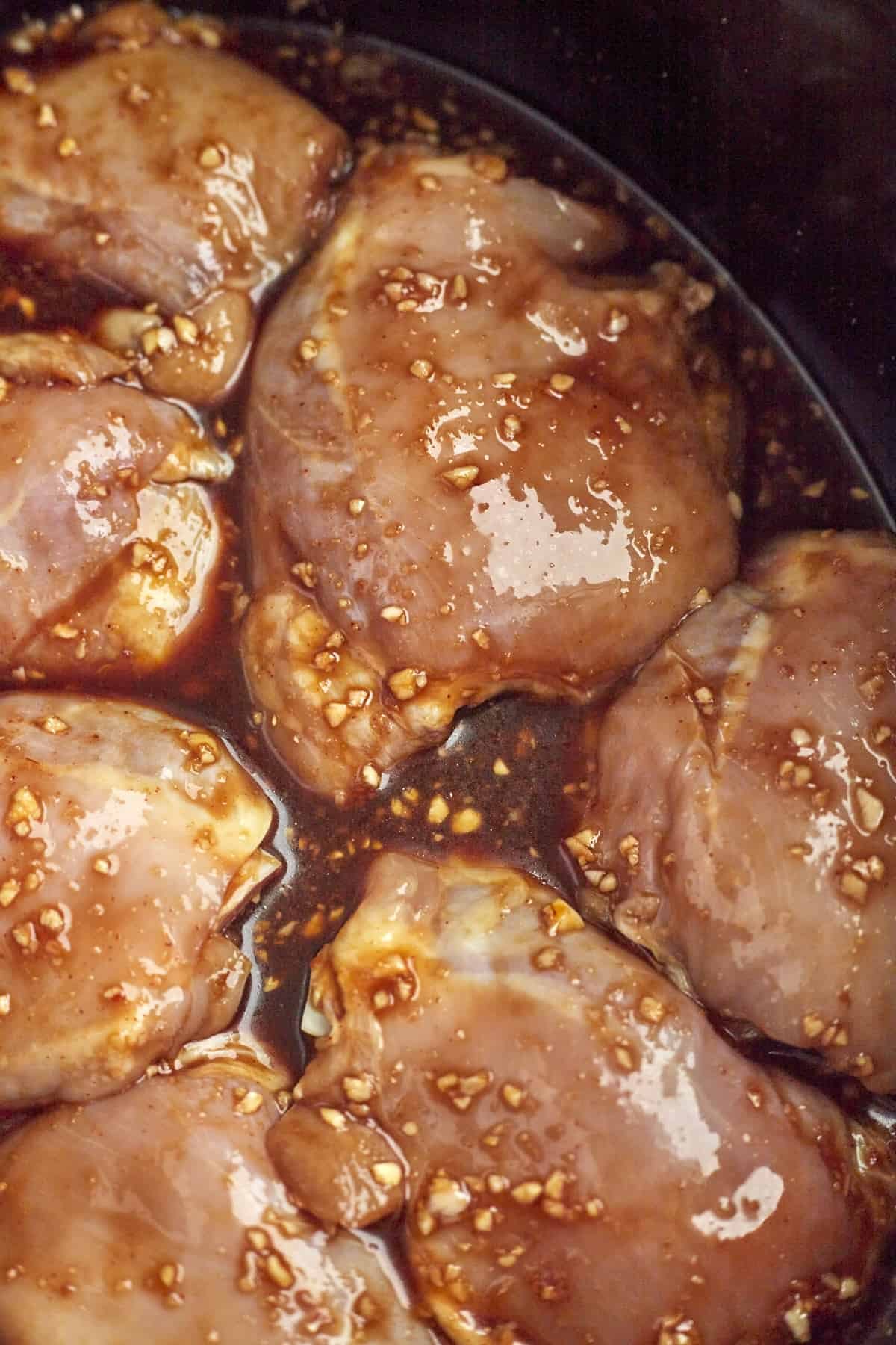 raw chicken thighs in a garlic marinade