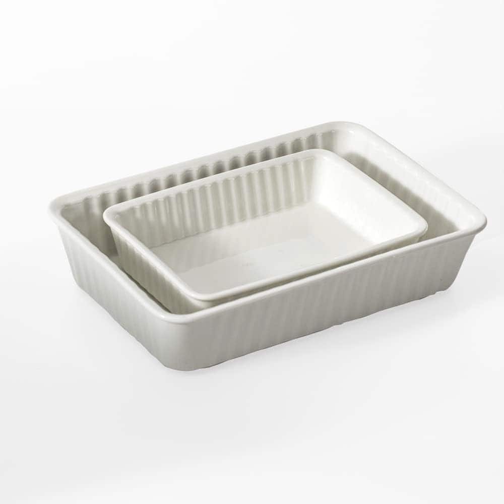 Two white ceramic baking dishes.