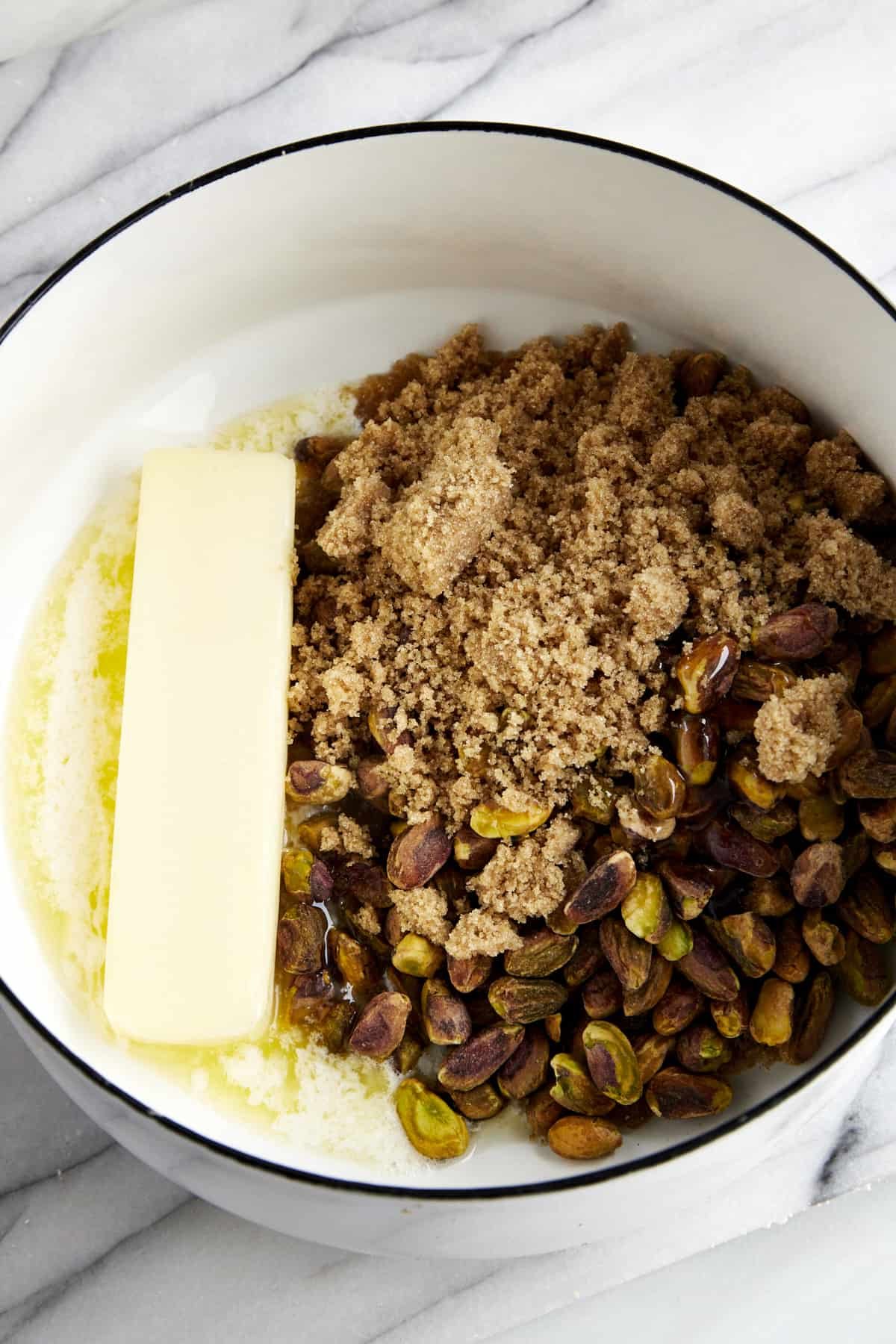 Butter, pistachios, brown sugar, and salt in a saucepan.