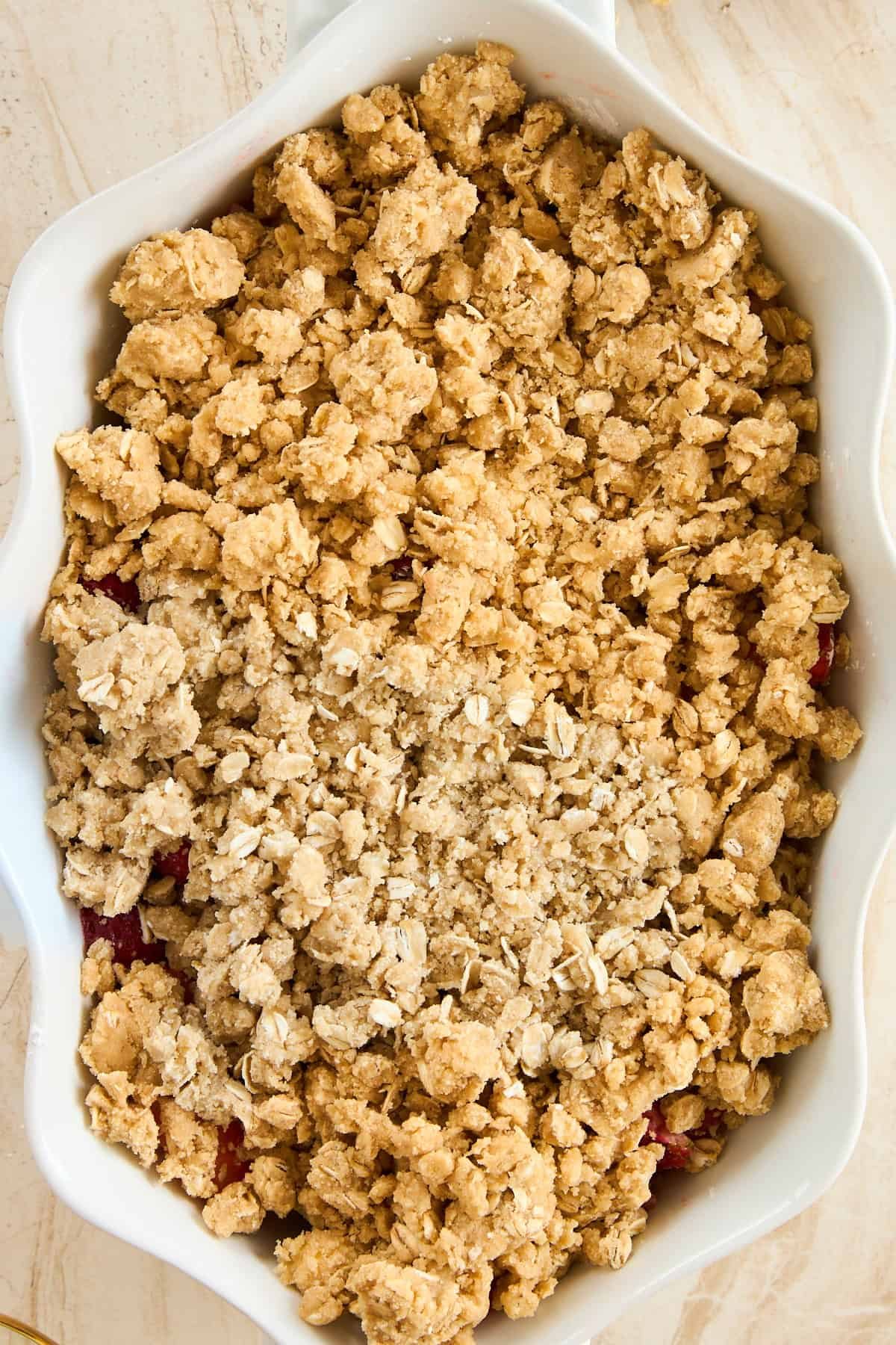 A baking dish full of strawberry crisp.