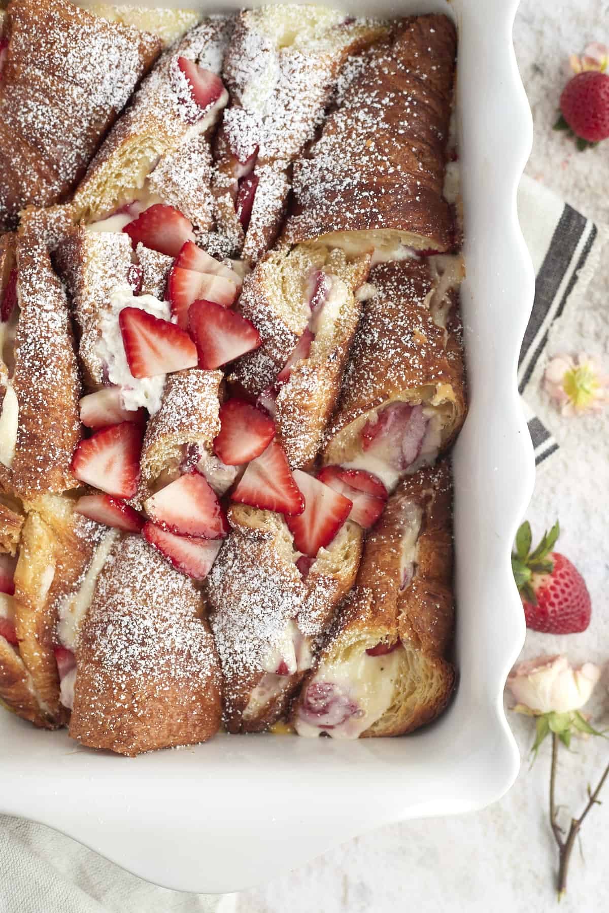 strawberry mascarpone french toast in a white baking dish