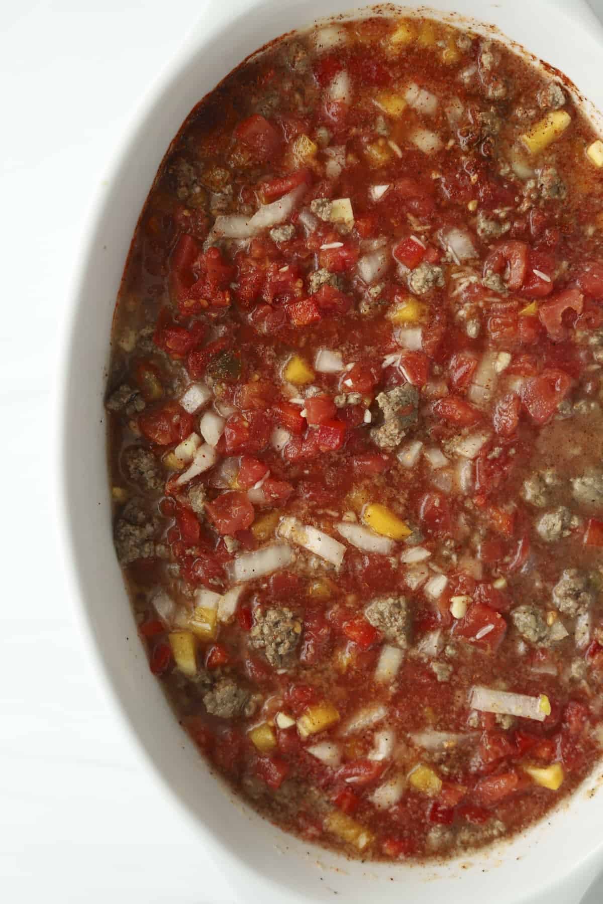 baking dish of tomatoes peppers and ground beef