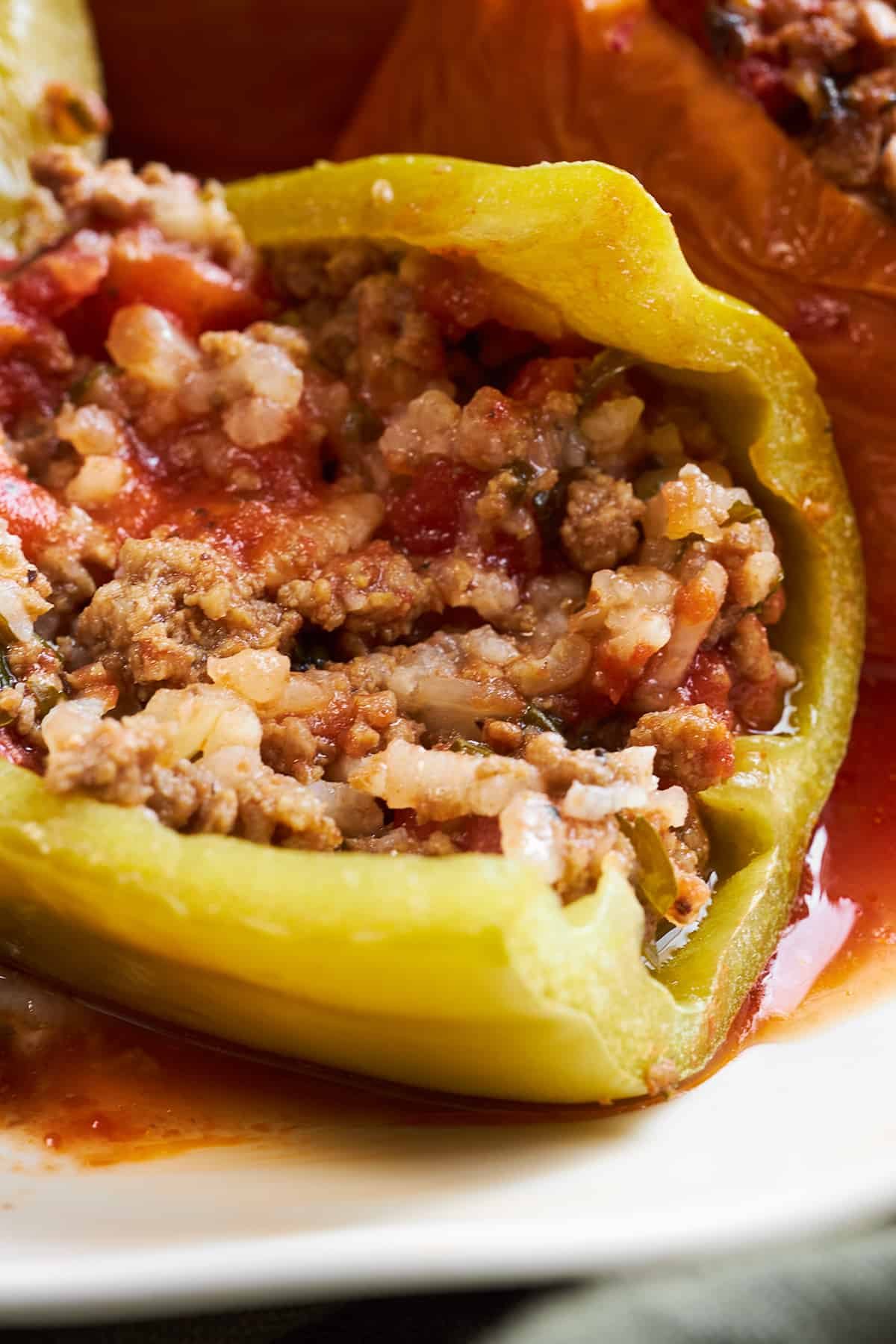 A slow cooker Mediterranean stuffed pepper sliced in half.