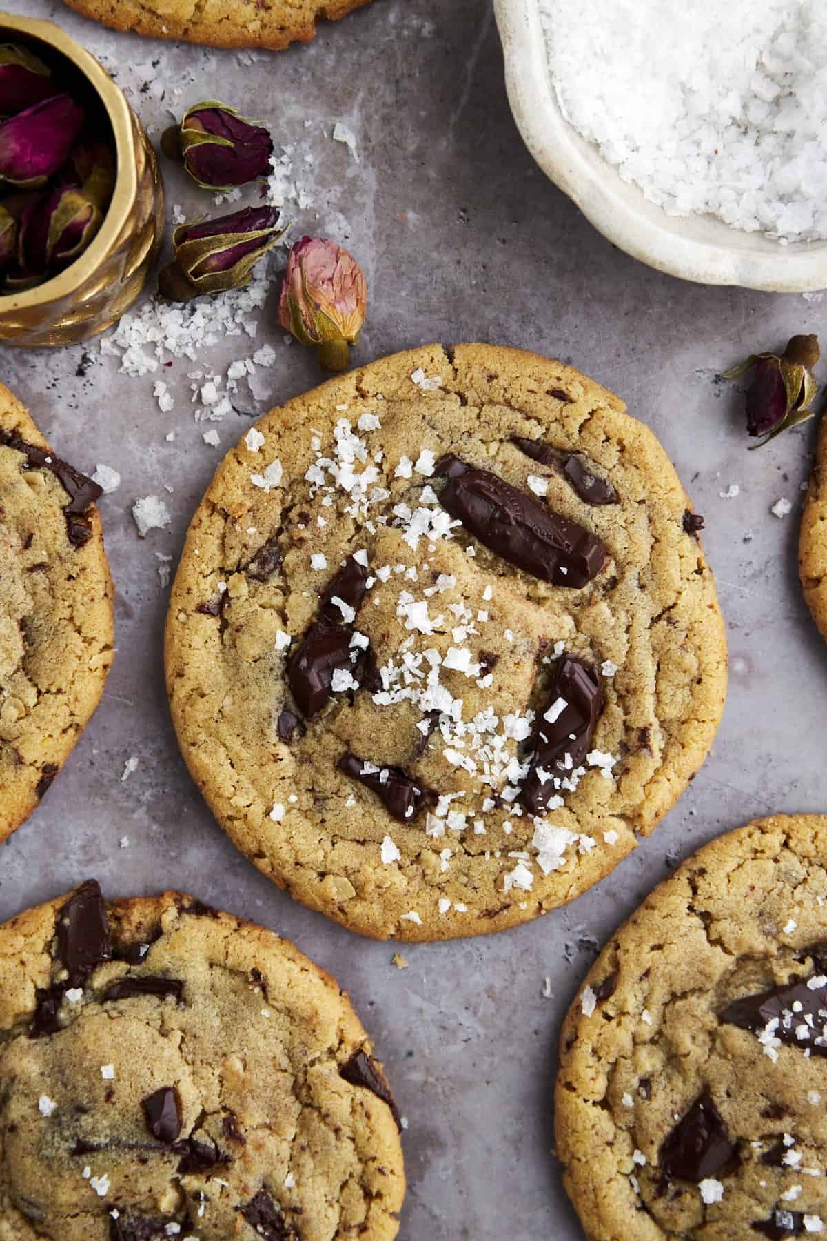 a tahini chocolate chip cookie topped with sea salt