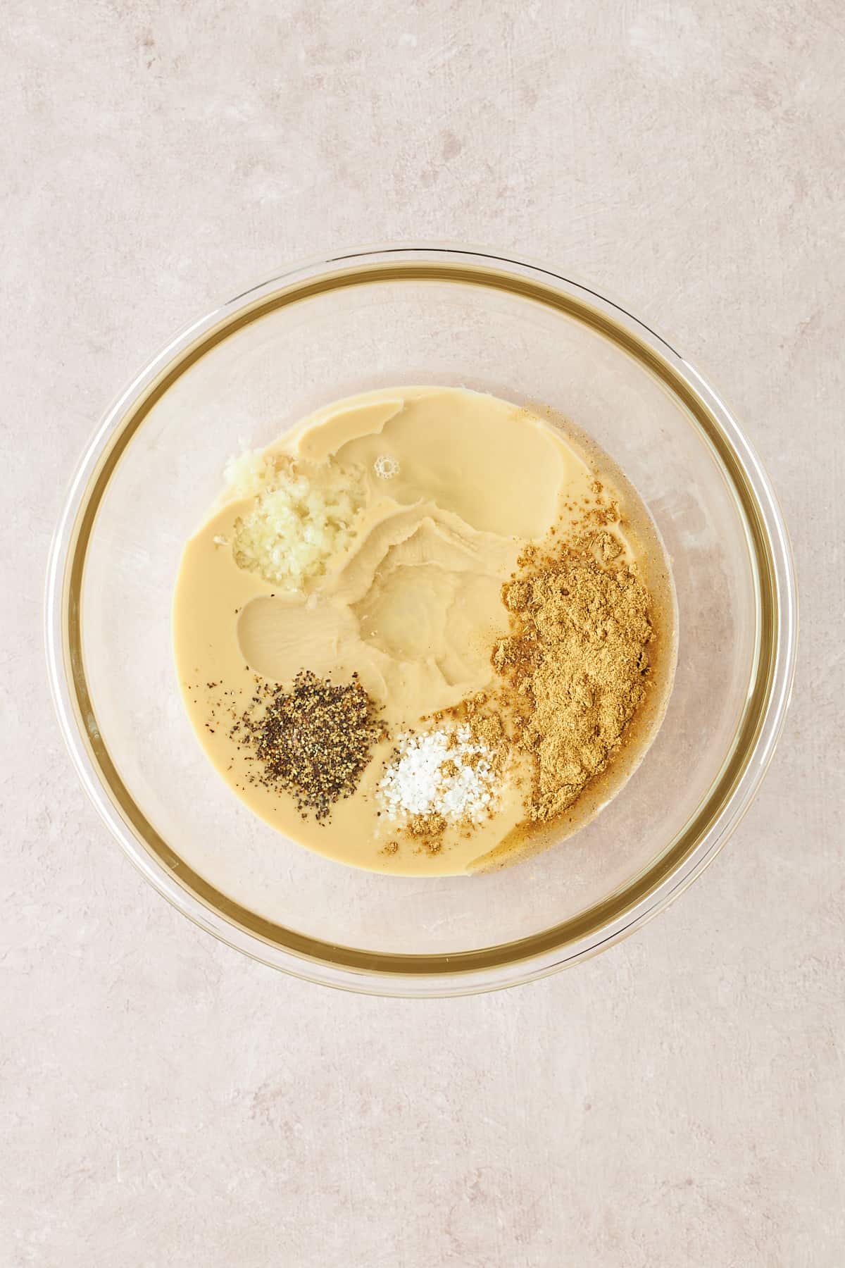 Tahini dressing ingredients in a bowl.