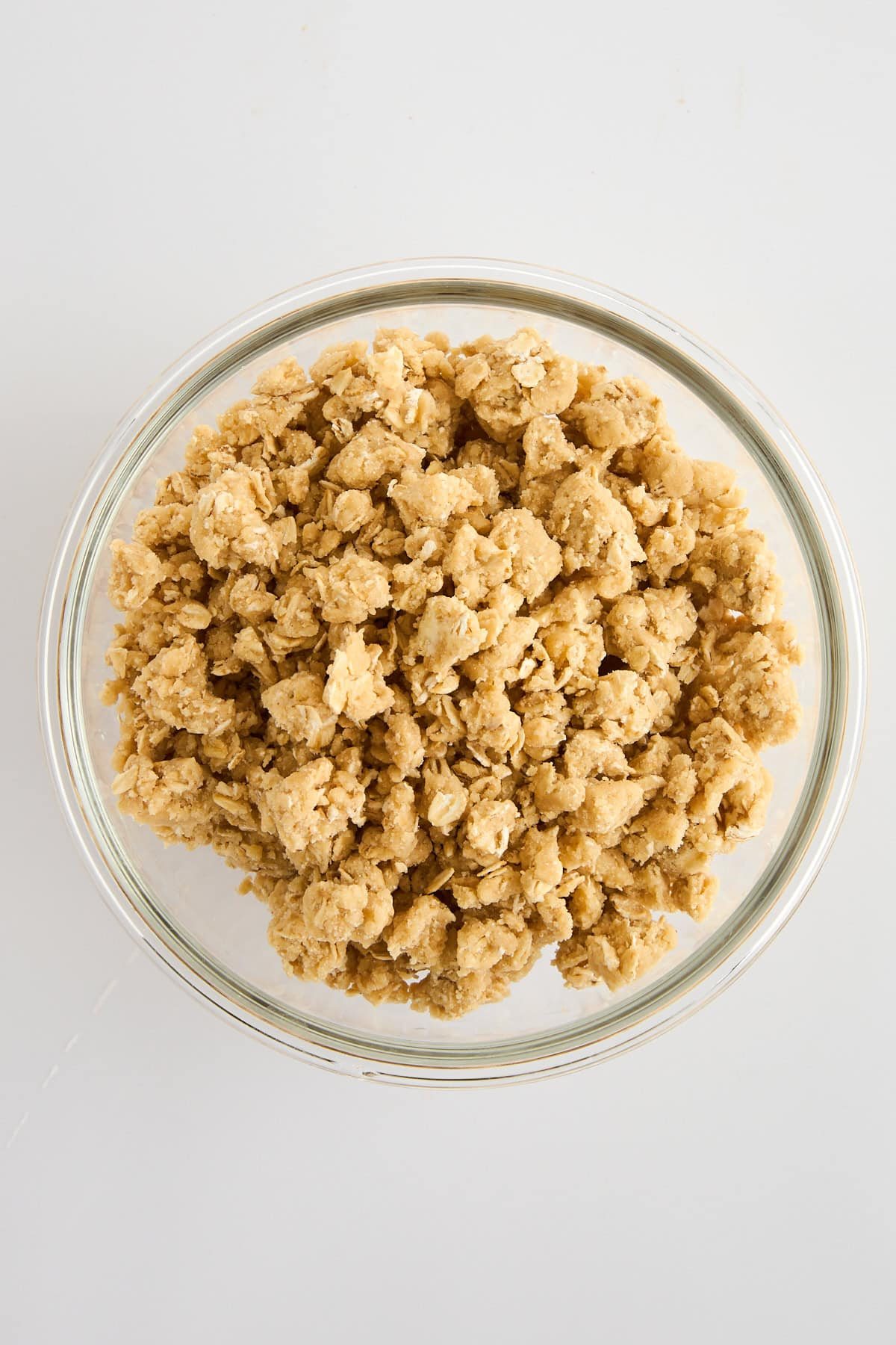 A bowl of oat crumble topping.