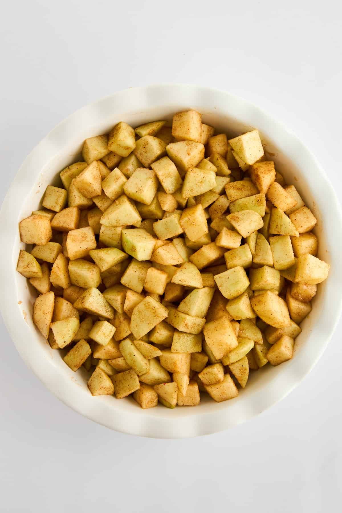 A bowl of choped apples.
