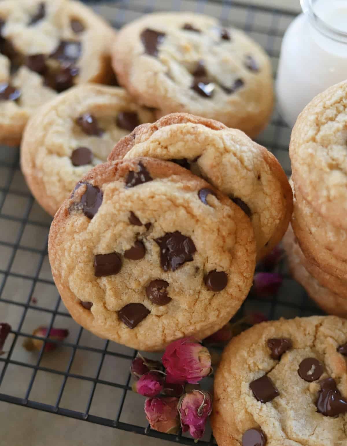 The best chewy chocolate chip cookies on a wire rack.