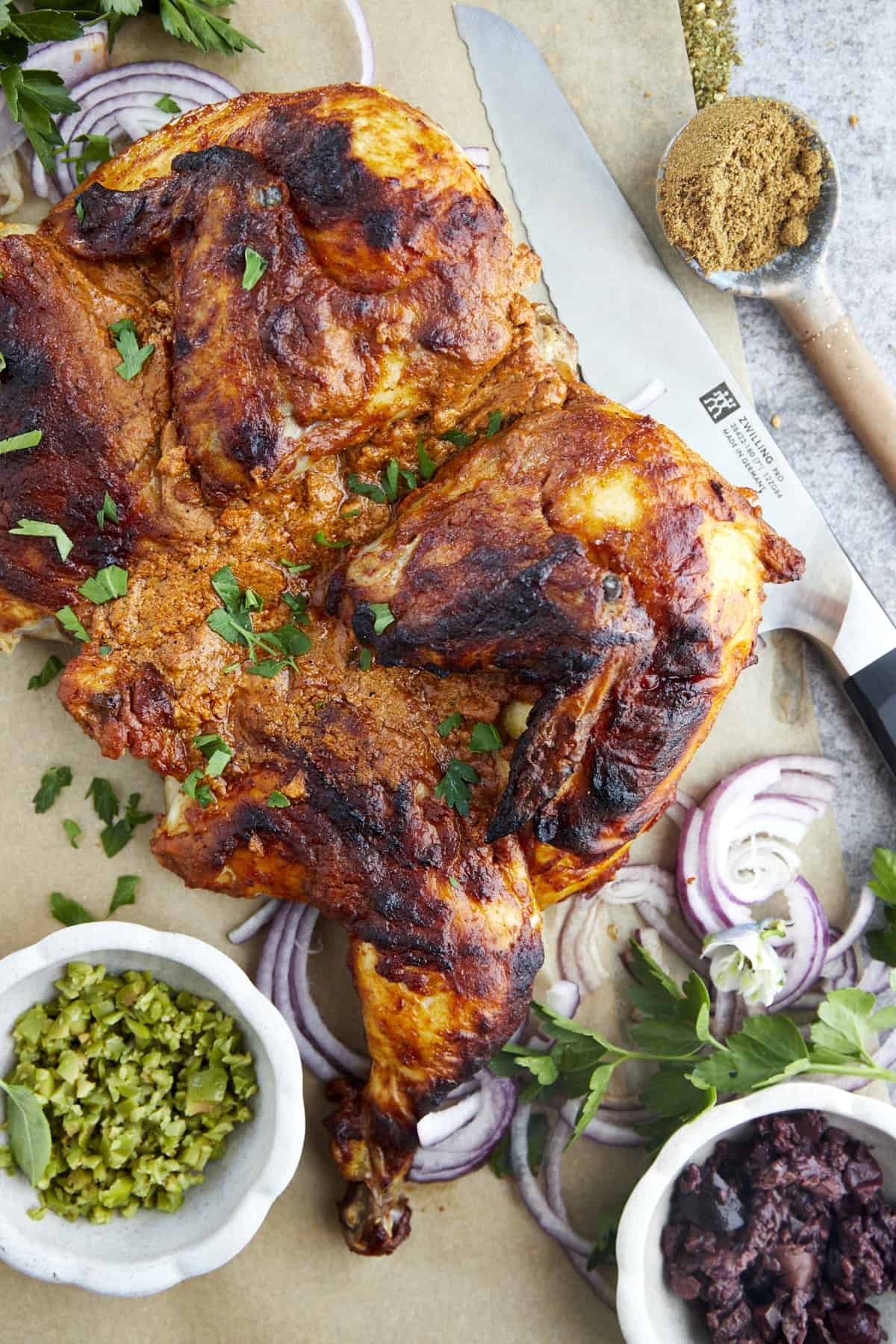 Overhead image of a Middle Eastern spiced roasted whole chicken.