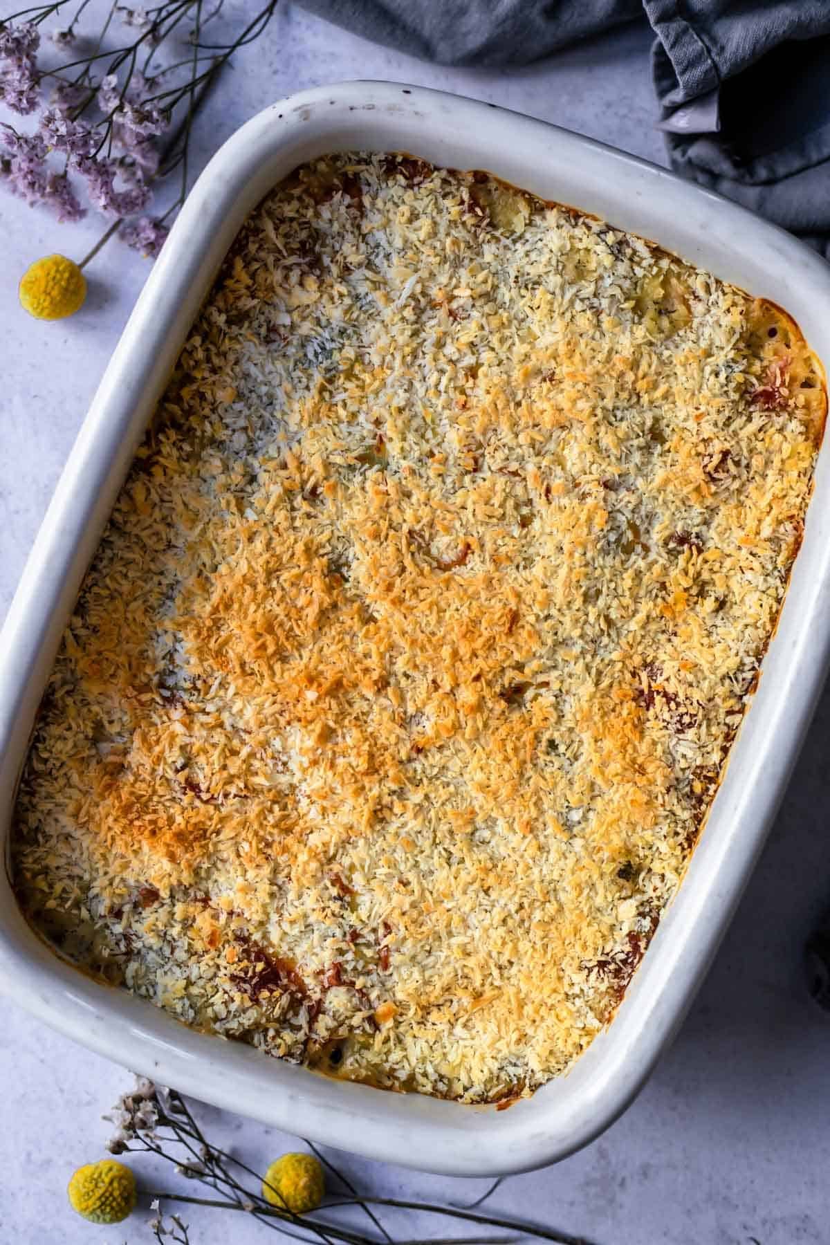 overhead image of a baked casserole in a white dish.