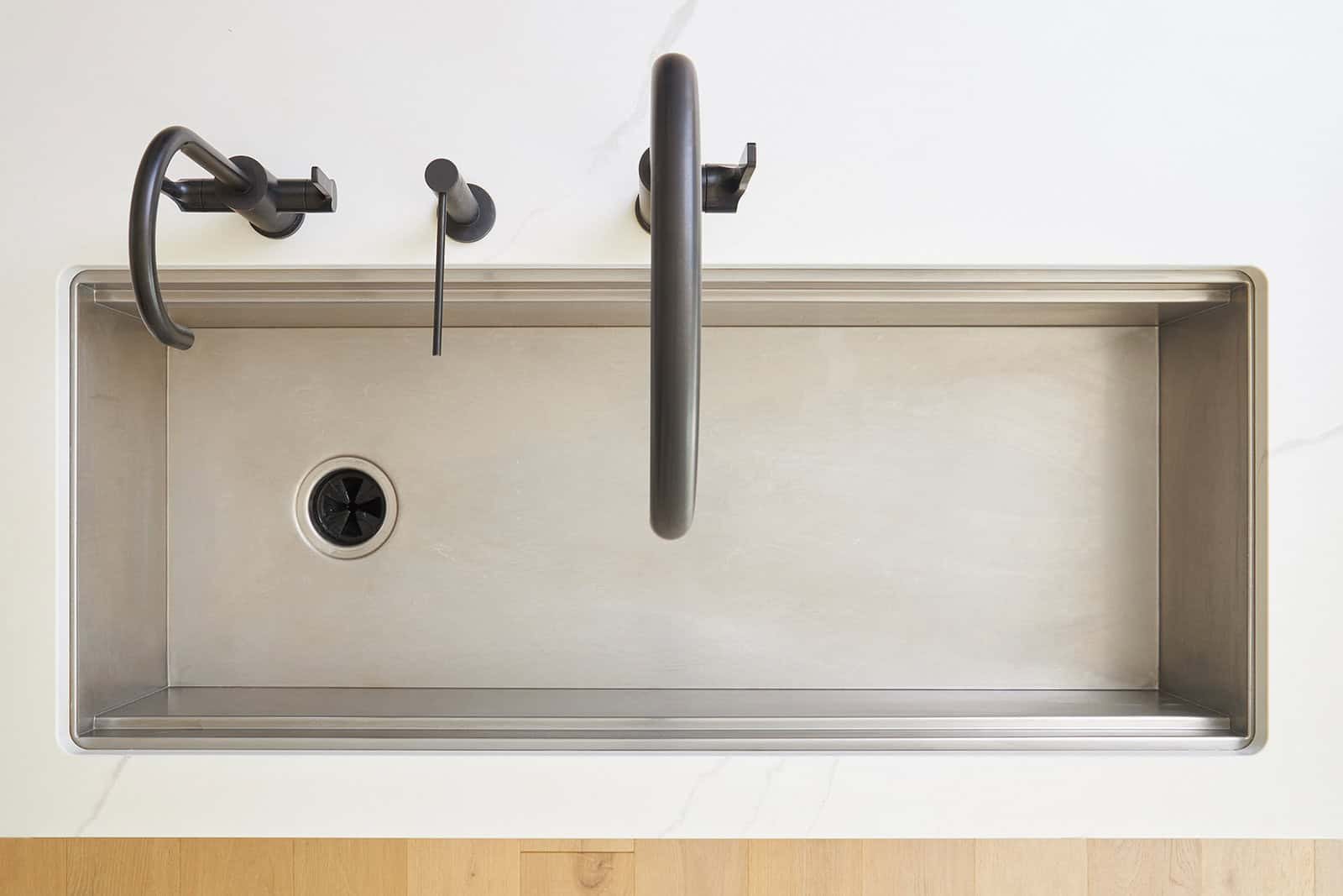 Overhead image of a clean kitchen sink.