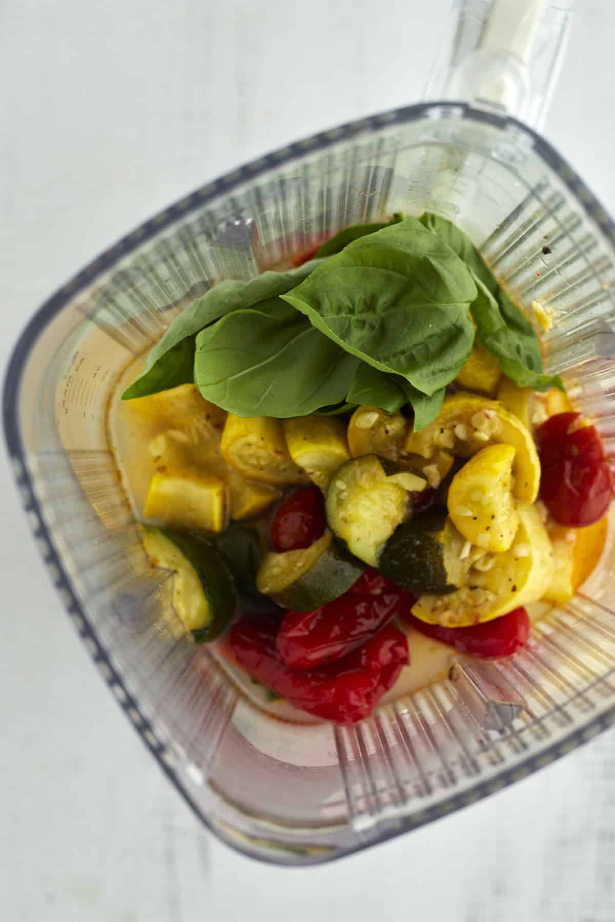 overhead image of roasted veggies in a blender