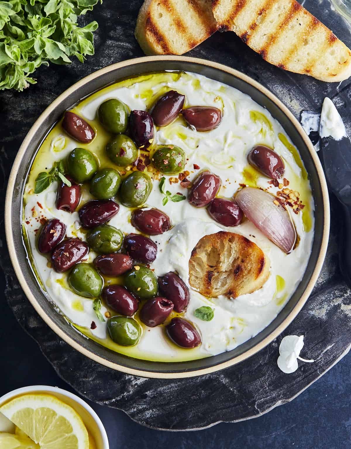 Whipped Feta Recipe with Roasted Olives at the Table