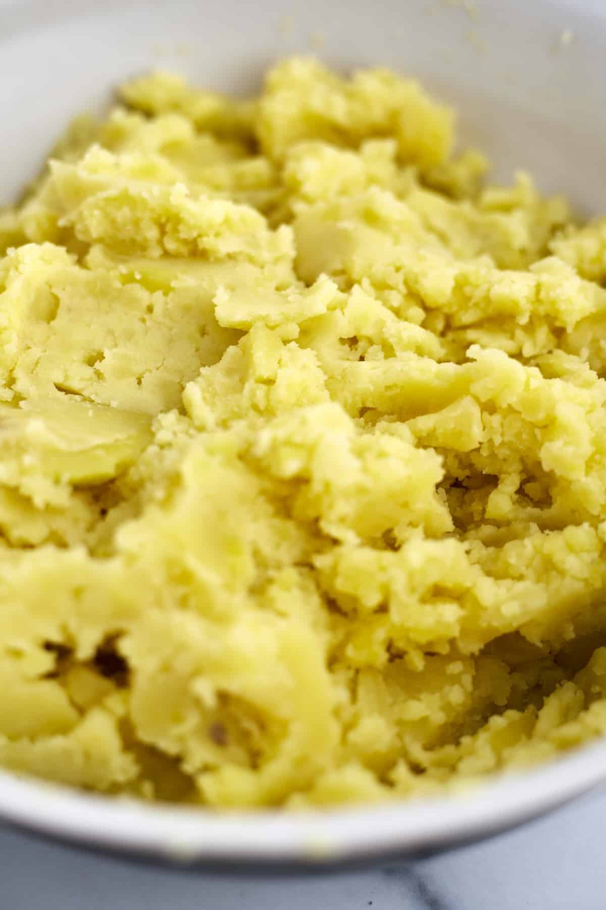 close up image of yukon gold mashed potatoes.