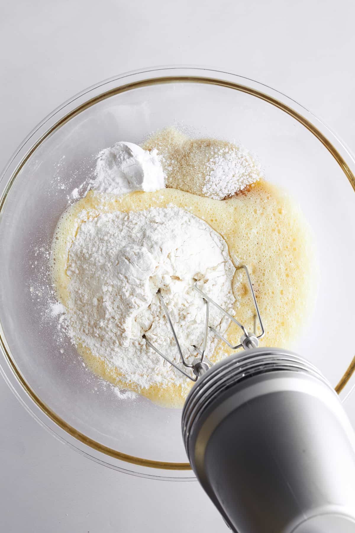 Zeppole ingredients being combined in a bowl.
