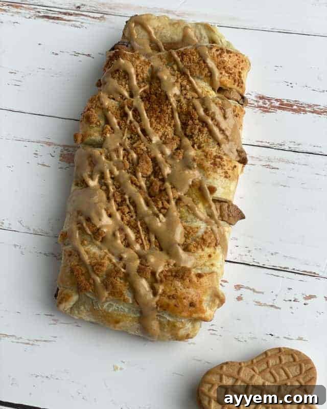 Peanut butter puff pastry braid with peanut butter drizzled on top.