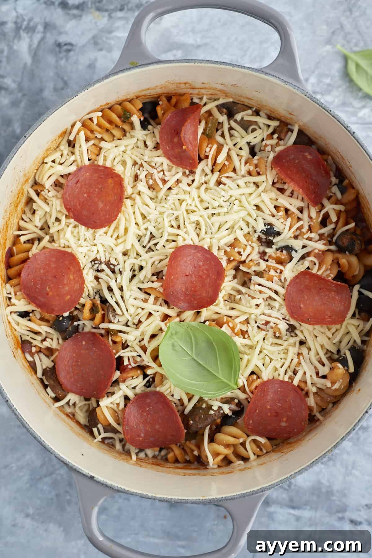 Pizza Night Pasta Pot 6 overhead image of a pot full of pizza pasta topped with cheese and pepperoni