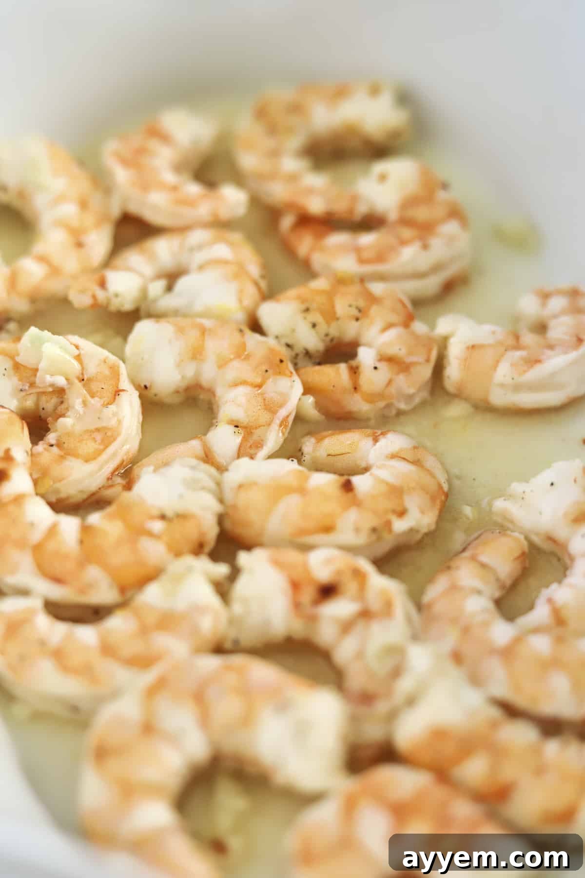 Golden Garlic Shrimp Bake 4 cooked shrimp in a baking dish