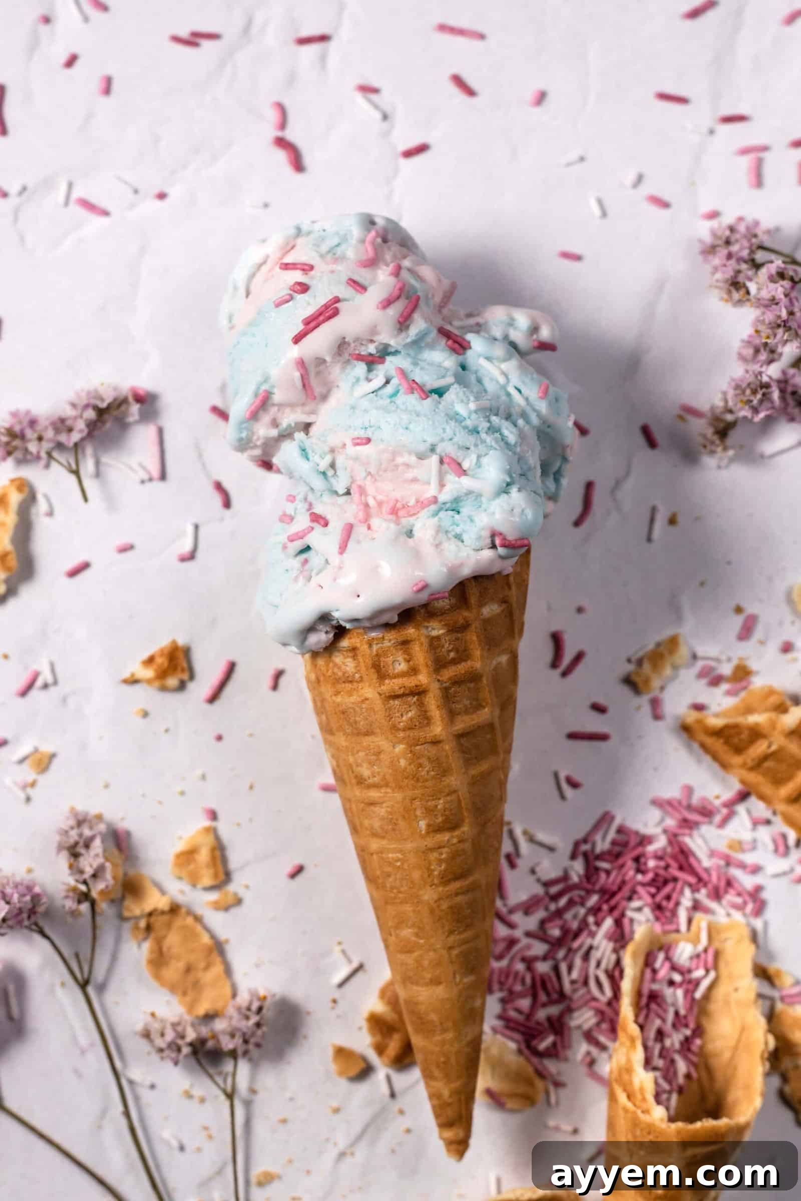 An ice cream cone stuffed with homemade cotton candy ice cream