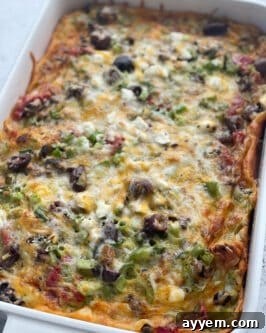 overhead image of a baked breakfast casserole with bread