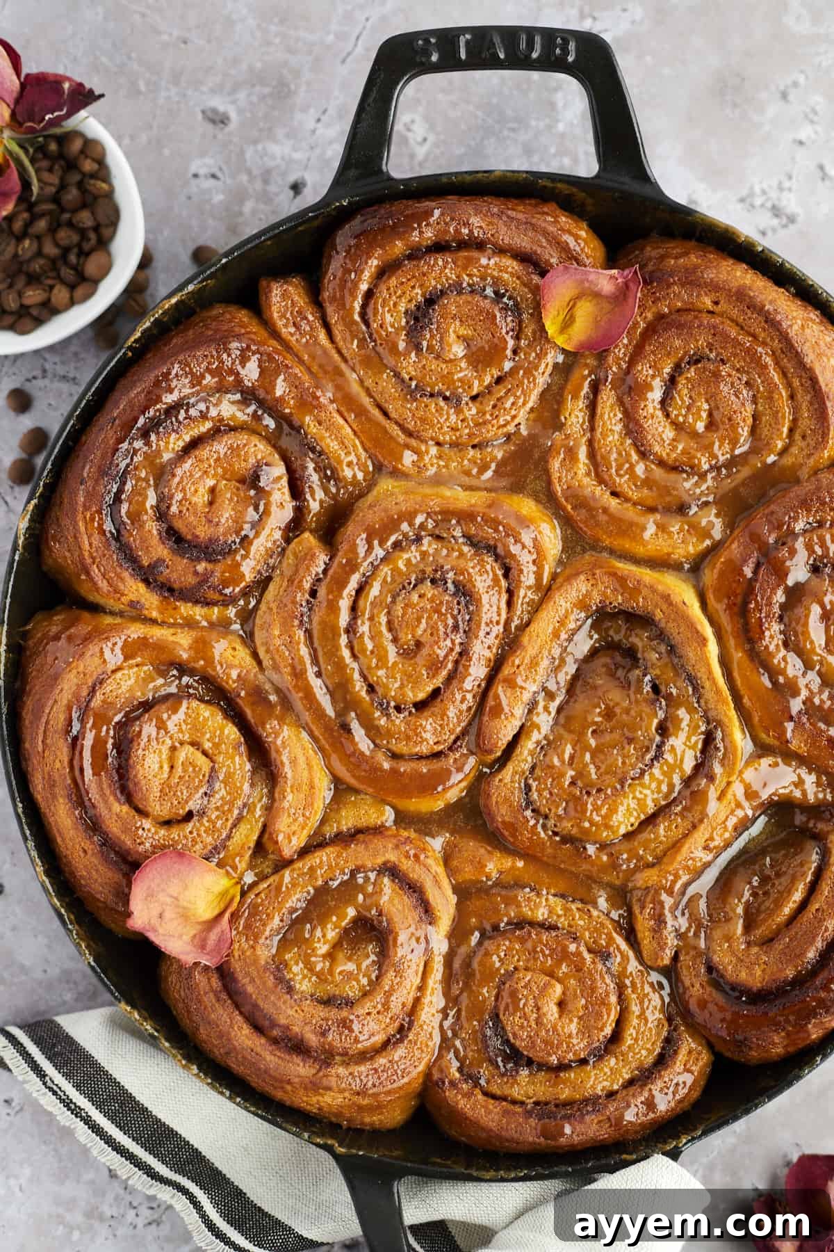 overhead image of caramel macchiato cinnamon roll cake in a skillet