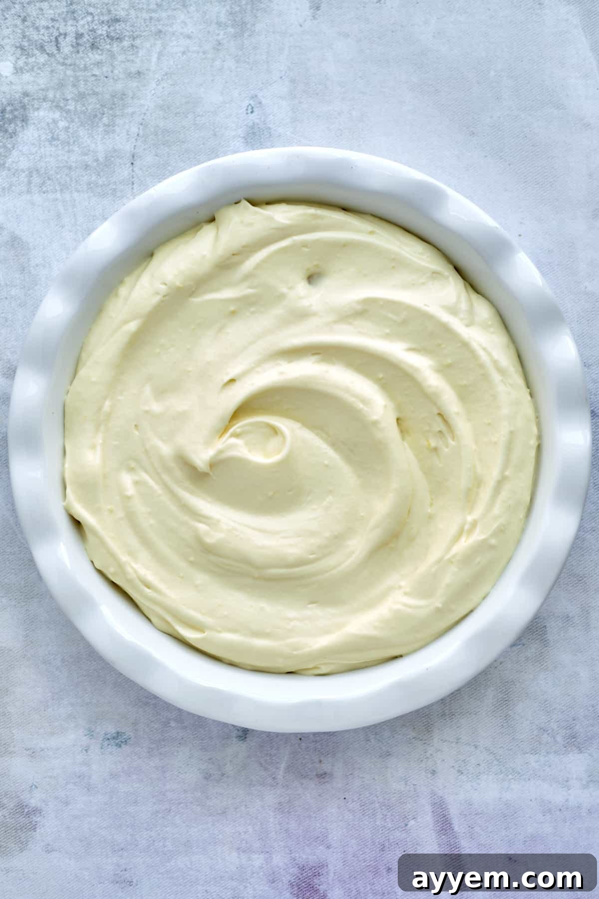 An overhead view of the partially assembled Magnolia Bakery banana pudding in a baking dish, showing the beautiful layers.