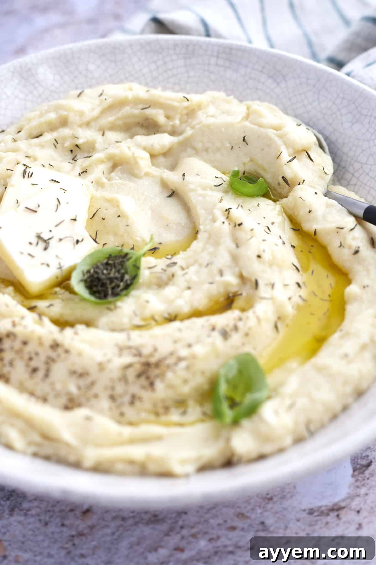 baked cheesy mashed potatoes with butter