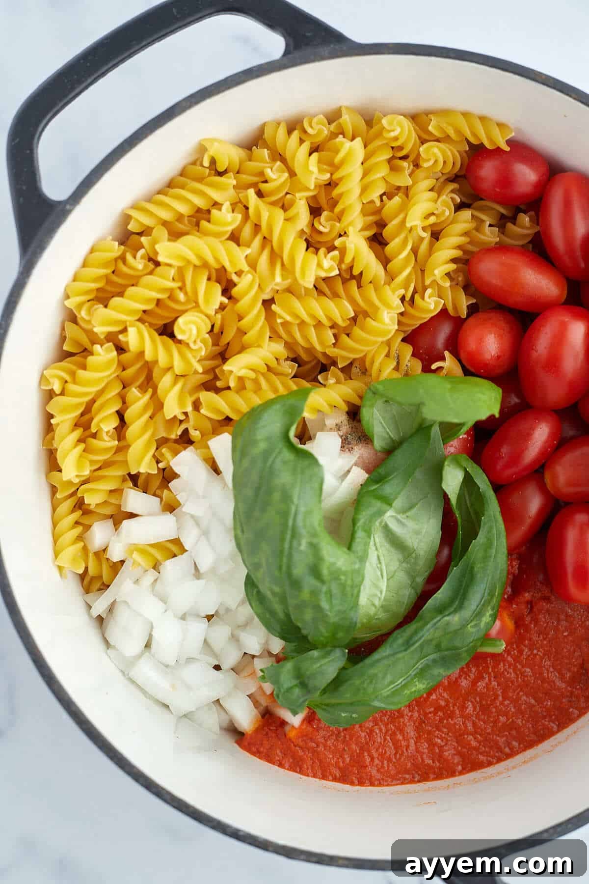 overhead of one pot caprese pasta in a pot