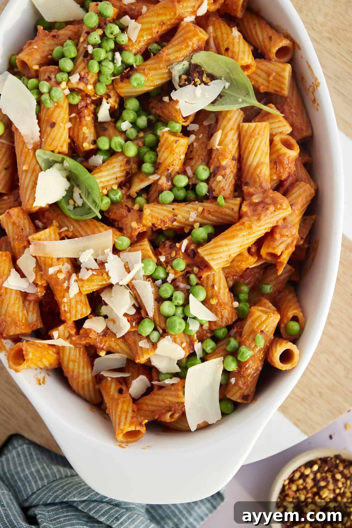 Fiery Rigatoni Bake 2 baked spicy rigatoni with peas and shredded parmesan