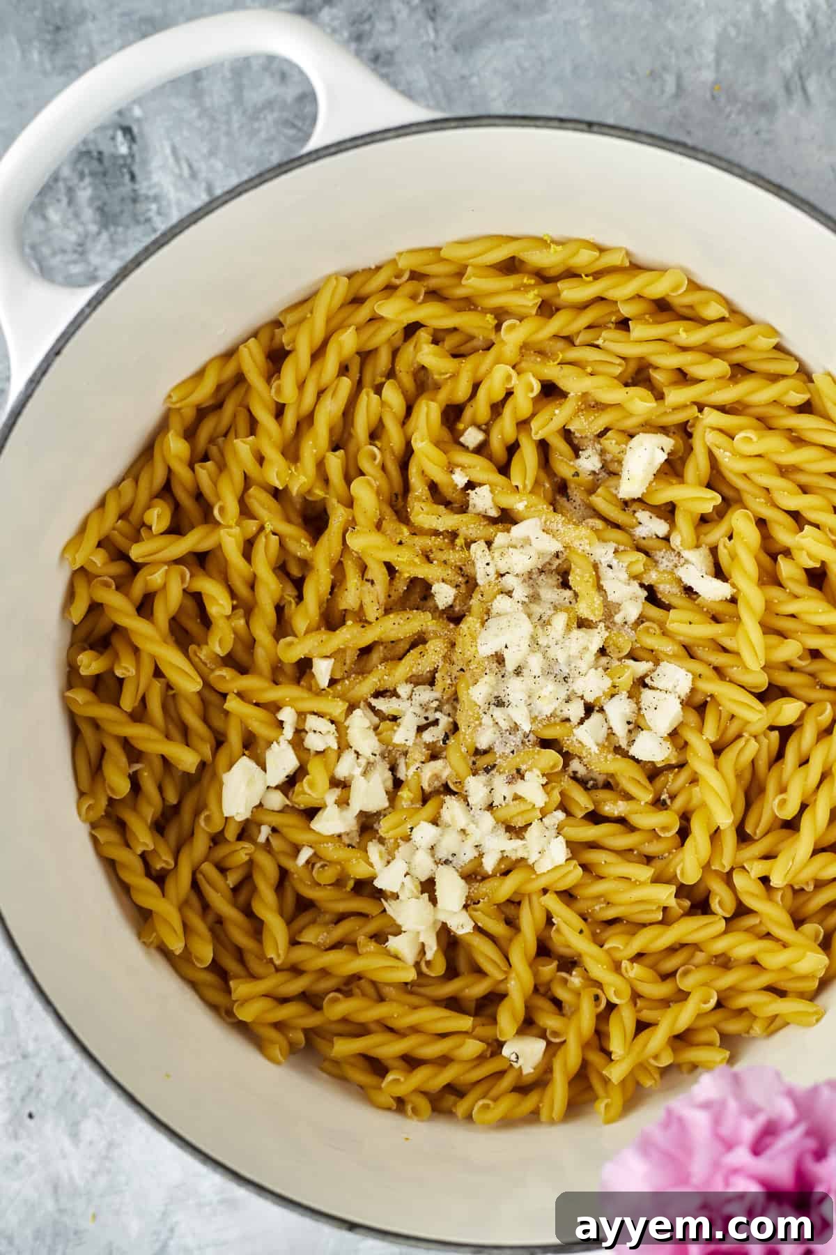 Creamy Lemon Ricotta One-Pot Delight 3 pot full of uncooked pasta noodles topped with Parmesan, ready for cooking