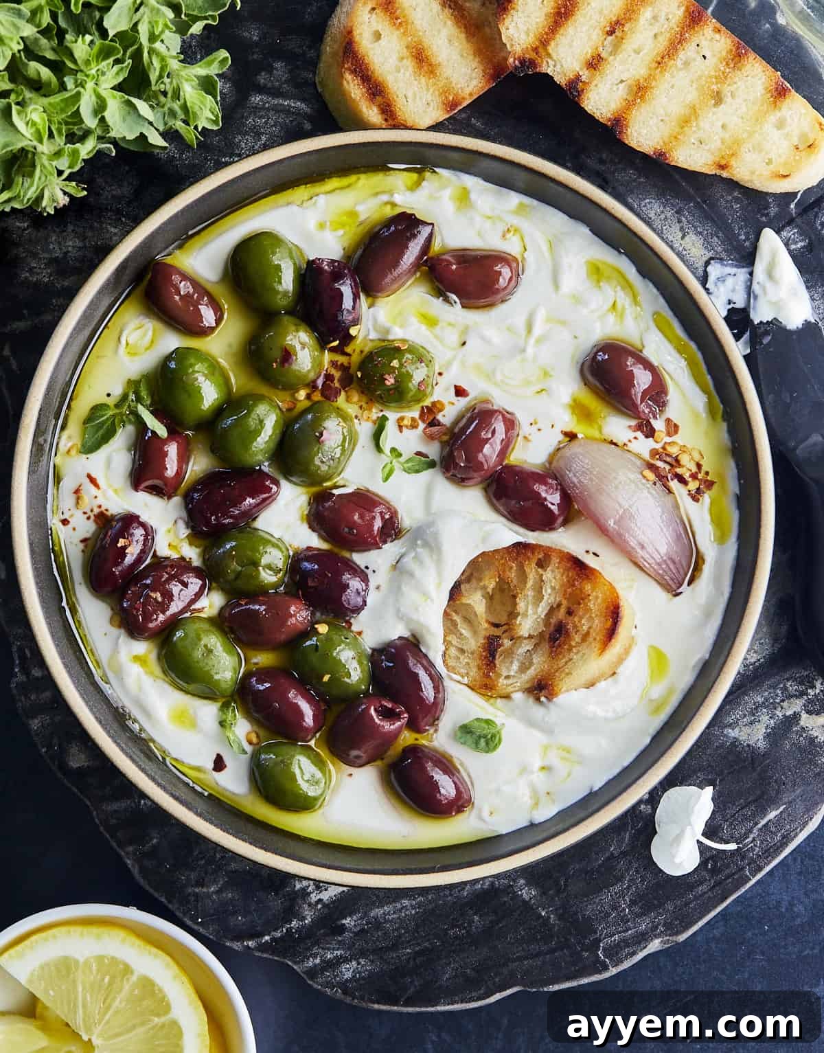 Whipped feta topped with roasted olives