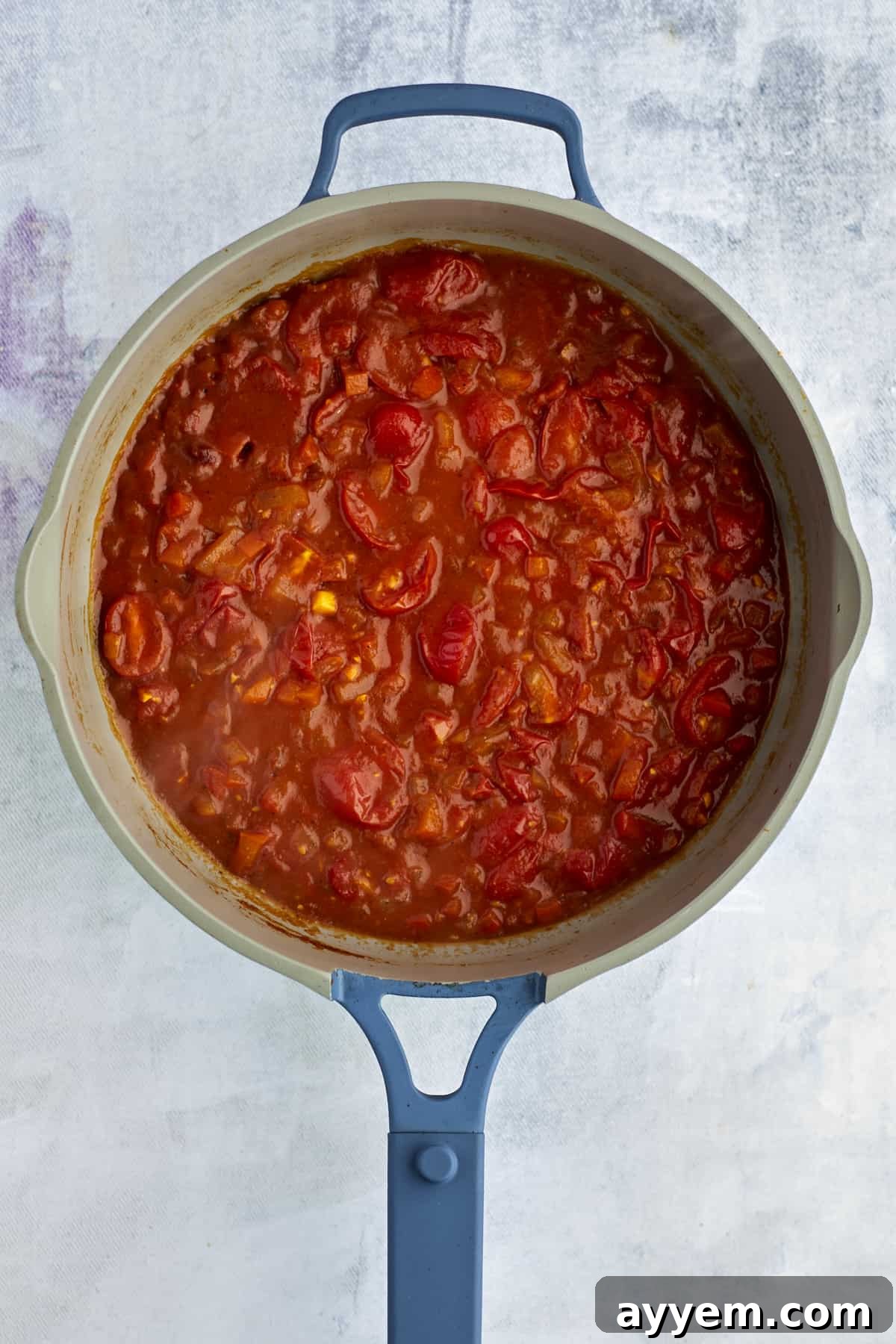 Feta Shakshuka Made Easy 7 The rich, reduced shakshuka sauce simmering to perfection in a pot, ready for the eggs.