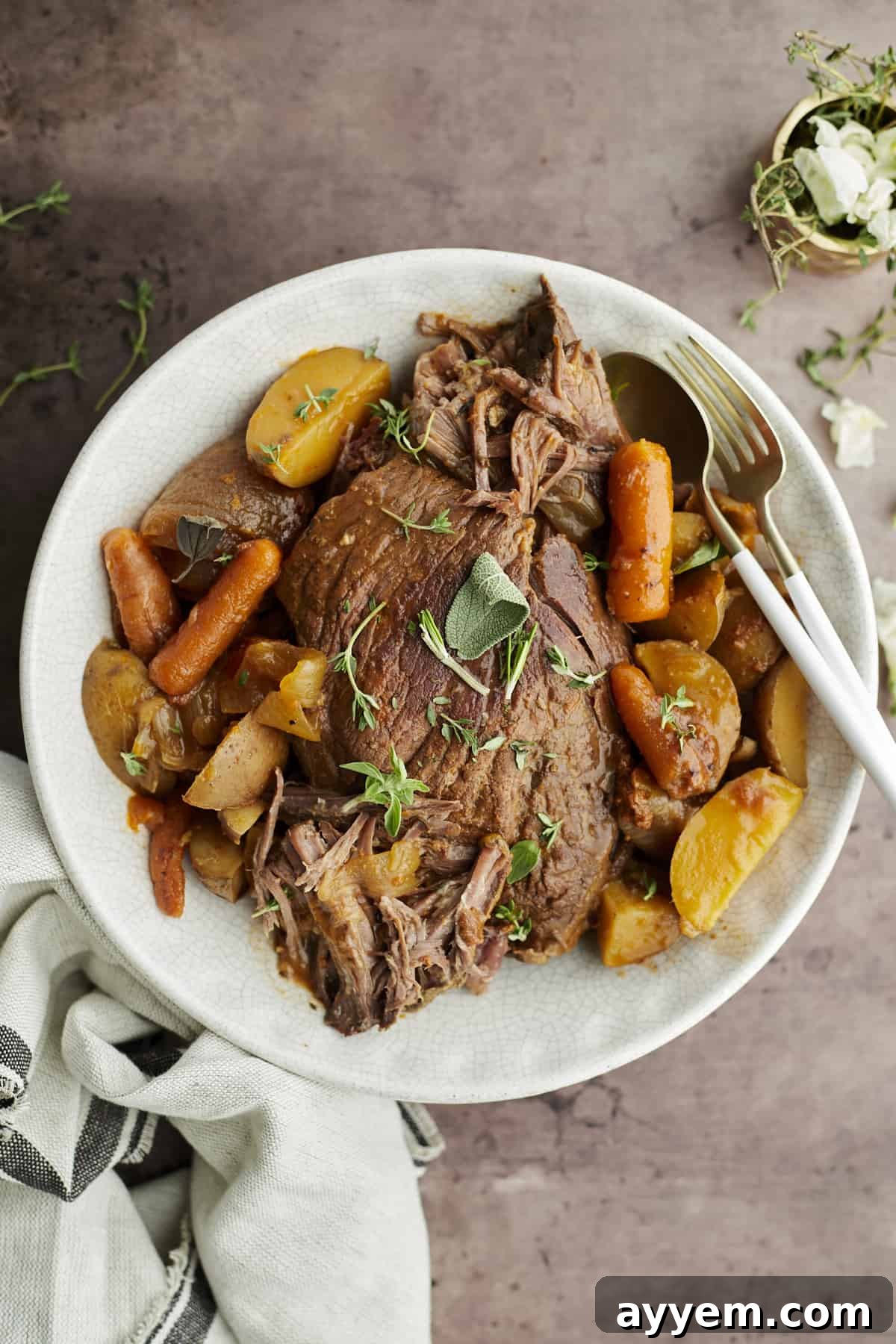 A beautifully cooked slow cooker beef pot roast with tender vegetables.