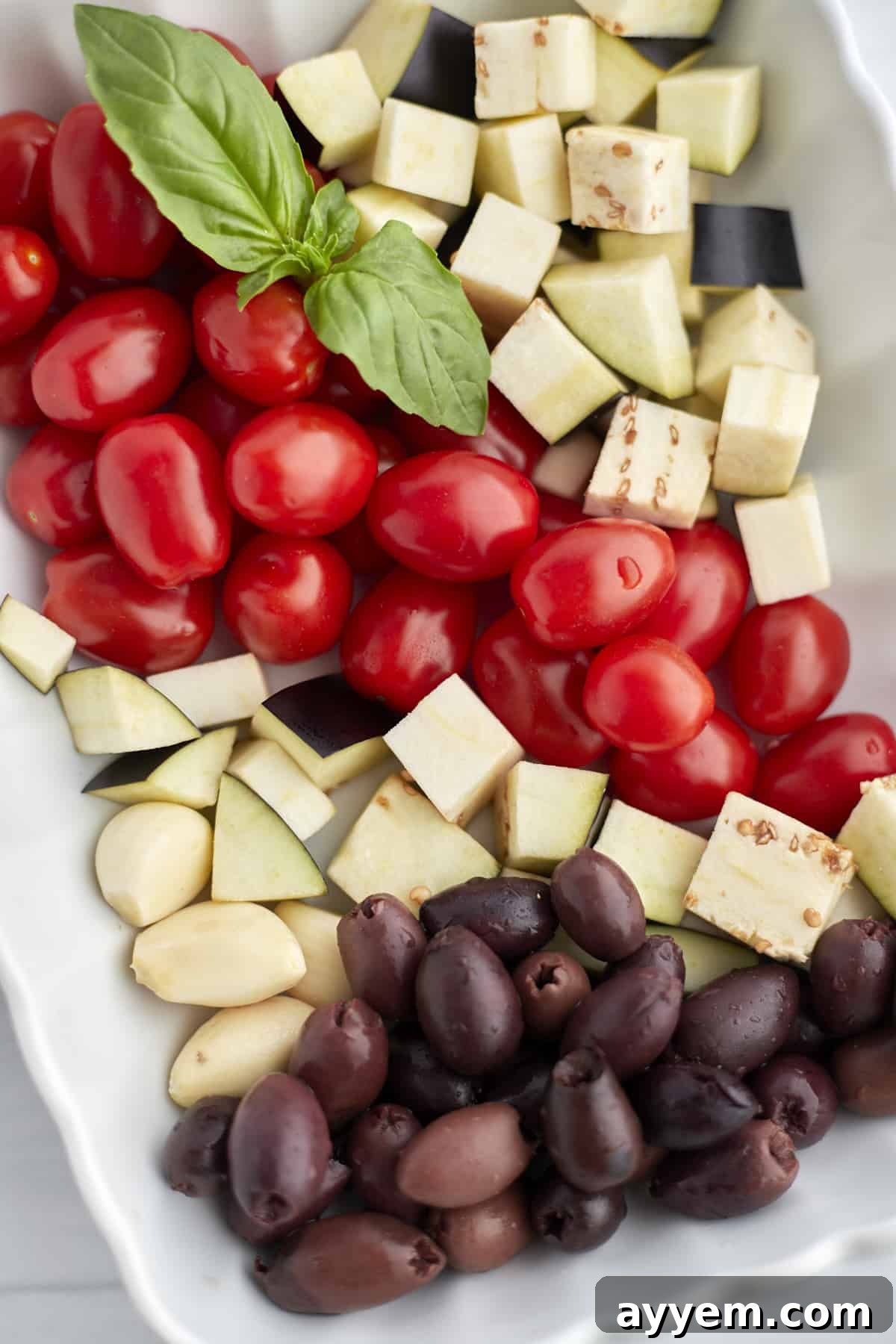 Close-up of roasted eggplant and tomatoes with olives
