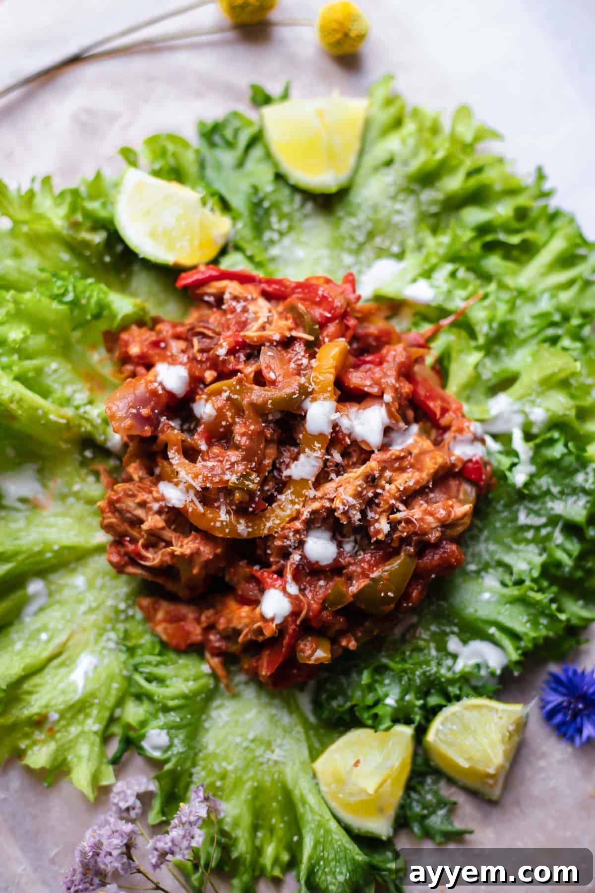 Overhead view of Instant Pot chicken fajita mixture presented on a crisp lettuce cup.