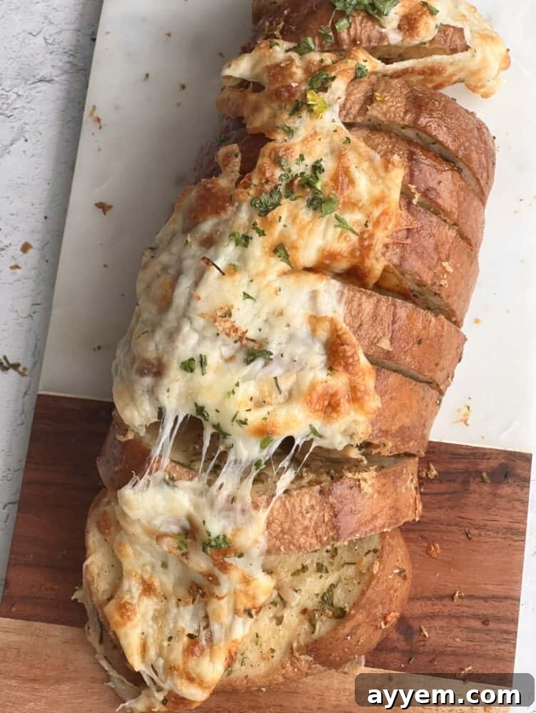 overhead image of a loaf of cheesy garlic bread 